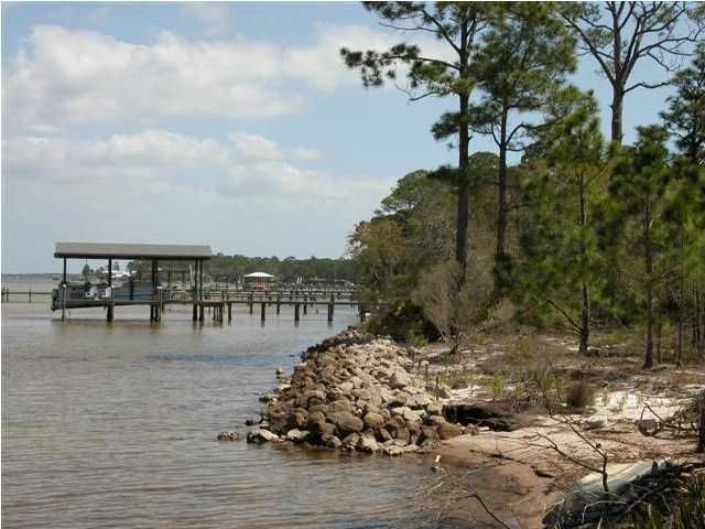 BEAUTIFUL BAYFRONT LOT WITH 100+ FEET OF WATER FRONTAGE, LOCATED IN CREEKWATER BAY SUBDIVISION CLOSE TO PELICAN BAY! LOT HAS A WELL AND RIP-RAP. UTILITIES IN THE COMMUNITY. BUILD YOUR DREAM HOME ON THIS GORGEOUS LOT WITH BREATHTAKING VIEWS OF THE BAY!