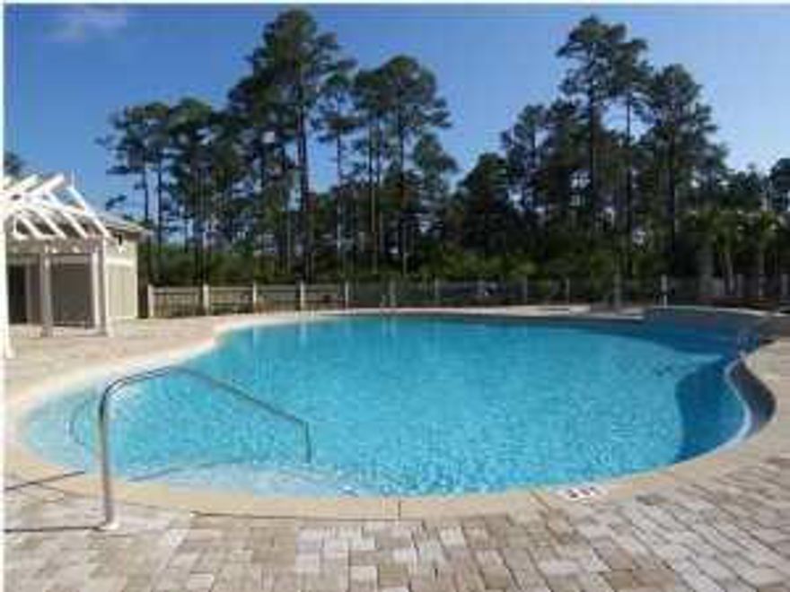 Across the street form the Amenity Area and the boat launch. Homesite has an alleyway for carriage house option and is across the street from community pool and pond. Grayton Bayou located only 5 mins from beach. Professionally landscaped with Florida cottage style homes. Many amenities - common area with pond, nature areas, swimming pool, picnic area, bayfront park, and boat launch in close proximity