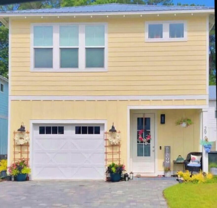 PRICED TO SELL! Discover this ray of sunshine! This charming and quaint community is located across from the bay with a boat launch near by! This captivating craftsman style home is conveniently located in the peaceful community of Lighthouse Pointe. Within just a few minutes walk, is a variety of local favorite Bay Front restaurants, with live music daily. Your new home is less than 4 miles from the pristine beaches of the Emerald Coast offering white sand beaches and emerald waters. The attention to detail and dedicated craftsmanship is evident in this 3 bed/ 2.5 bath home. This residence offers a thoughtfully designed layout with wood-like tile flooring on the main level and LVP flooring upstairs, ensuring both style and easy maintenance.The inviting living area seamlessly transitions