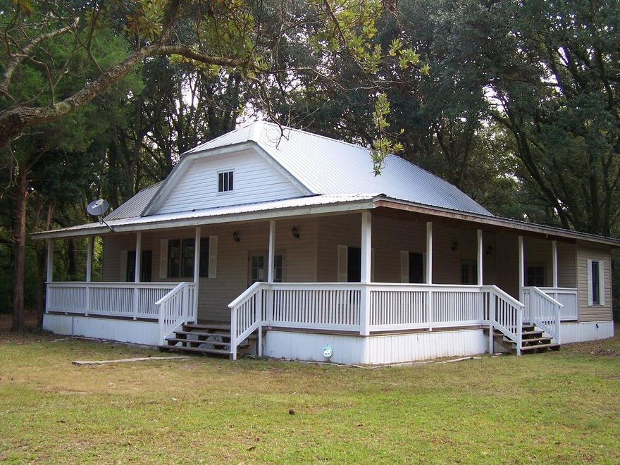 MOTIVATED SELLER, ALL REASONABLE OFFERS WILL BE CONSIDERED. Completely renovated 2 bedroom, 2 bath historic home is located just outside the city limits. This remarkable home offers wrap around porches, 10' ceilings throughout, preserved original hardwood floors, an updated kitchen featuring cherry cabinets, new appliances, & updated fixtures. There is access to the second floor, currently it is unfinished, but offers an additional space for a bonus room or 3rd bedroom. The home's renovations finished in 2010 included a new roof, Jeldwin impact resistant doors & windows throughout, vinyl siding, central heat & air, electrical, plumbing, light fixtures, and ceiling fans. Some additional work still needs to be completed on the exterior. This homes is truly a must see.