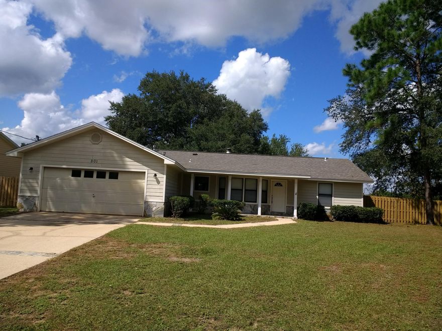 Available Now - South of I-10 located just off of PJ Adams drive this 3bed/2bth/2car garage with spacious corner lot. The home features cathedral ceilings throughout with a large open concept kitchen/dining/ family room with fireplace and luxury vinyl tile. Just off the family room is a large screened in porch perfect for entertaining or relaxing with your morning coffee. The master suite is large with ample closet space. The split bedroom design home has 2 additional bedrooms with ample closet space. Lawn maintenance is included in the rent as well. Call today to schedule an appt to view.