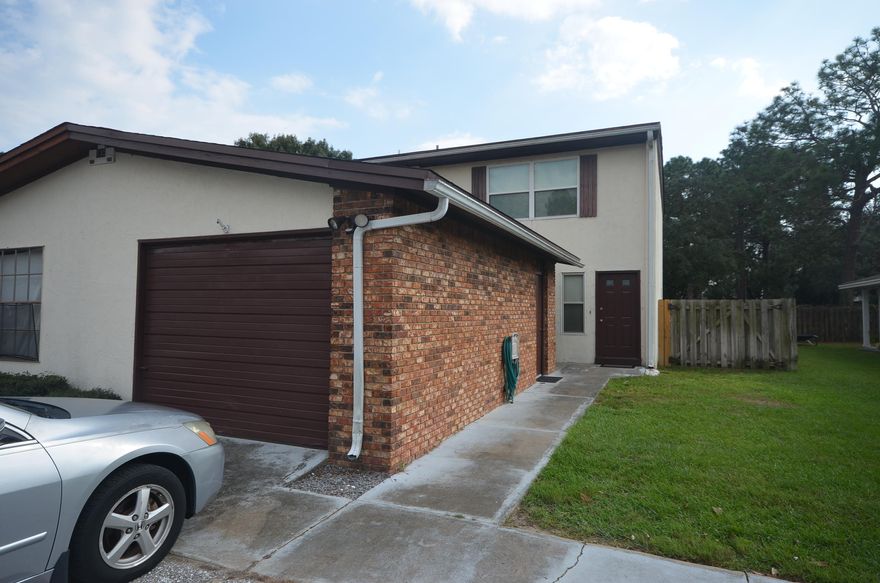 Great townhouse that has been updated. So close to military bases, shopping and schools! 3 bedrooms, 2.5 baths. Good size backyard for kids/pets to run around. Upstairs bedroom has French doors and a large balcony to enjoy your coffee in the mornings. Detached 1 car garage for extra storage. Downstairs features newer laminate wood floor. Laundry area located inside the unit. Large master bedroom upstairs with private bath. 2nd full bath upstairs as well for two additional rooms to share. Half bath downstairs so guests don't have to travel up. New windows in whole home - with hurricane fabric! Outside AC unit replaced this year. This unit is ready to sell! One year American Home Shield Warranty included.