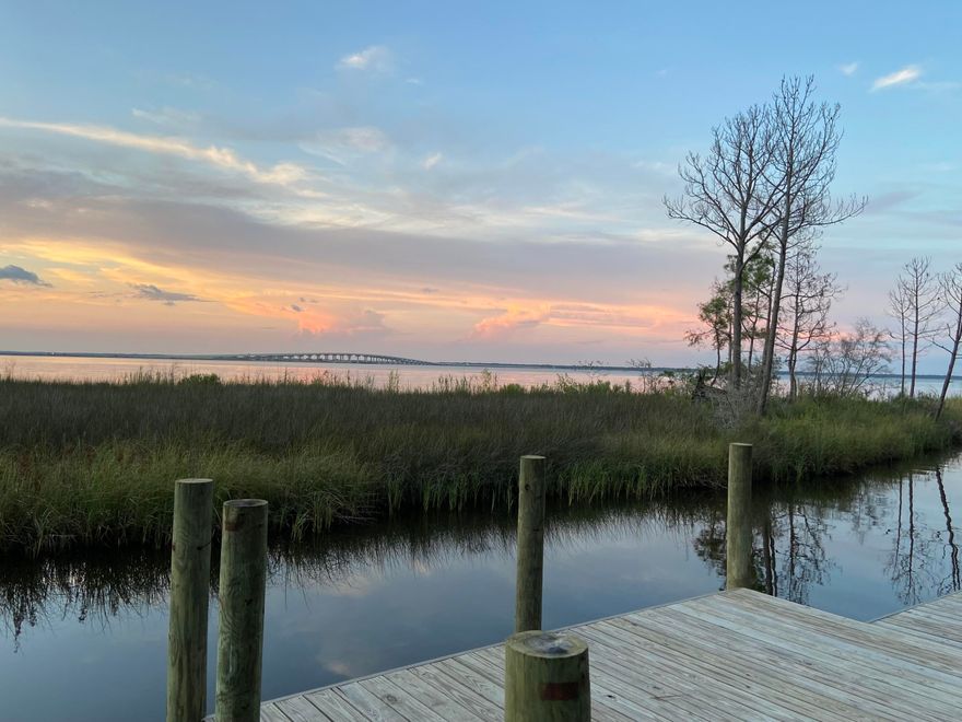 Incredible opportunity to build the home of your dreams on the this large waterfront lot in the serene gated neighborhood, The Estuary. Gorgeous trees and sunsets, private newly constructed dock is ready for your boating lifestyle. Amazing house plans can convey with purchase and are available for review.