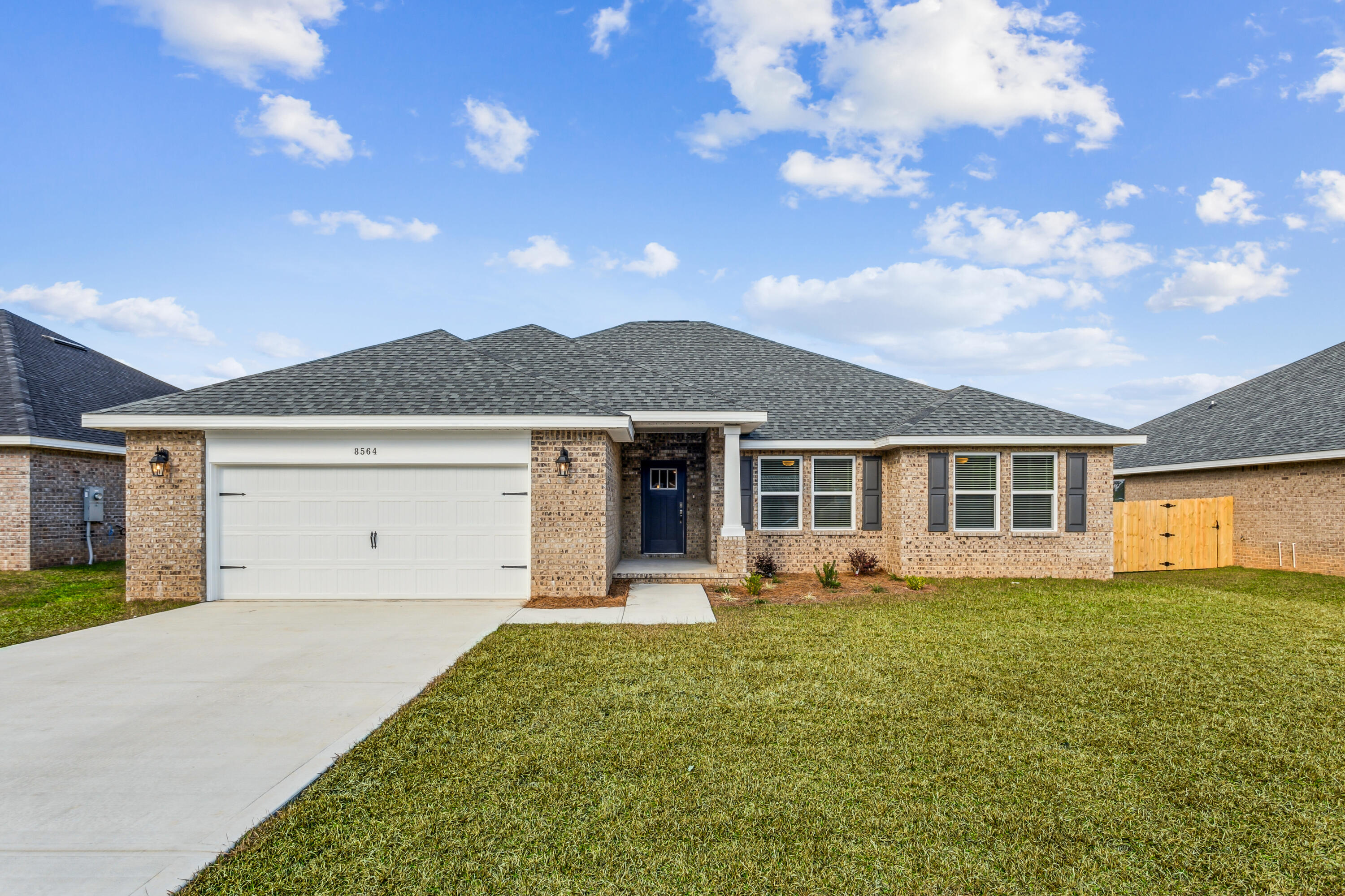 NEW CONSTRUCTION! NO HOA! Backyard Privacy Fence included! Crown Molding included! Blinds included! Discover your dream home in this stunning Liberty floor plan featuring 4 bedrooms and 2 baths. Enjoy an open floor plan with vaulted ceilings and a spacious kitchen complete with an island, stainless steel appliances, ample cabinet space, granite or quartz countertops, and slow-close cabinets and drawers. A separate pantry adds extra convenience. The Liberty floor plan is designed to meet your needs with a versatile fourth bedroom that can be used as an office, playroom, game room, or craft room. The split floor plan ensures privacy, with the master suite offering a serene retreat with a beautiful walk-in tiled shower and a separate garden tub. This home comes with a full backyard privacy fence, perfect for enjoying the .42-acre lot in peace. Crown molding accents the tray ceilings, and installed blinds add extra convenience. Located in a highly desirable new subdivision south of I-10 just off Hwy 87, you'll have easy access to both Navarre and Milton. Plus, you'll be just 20 minutes away from the pristine white sands of Navarre Beach, making coastal living a breeze. Projected completion is January 2025. Photos are of a similar home; colors and selections may vary.