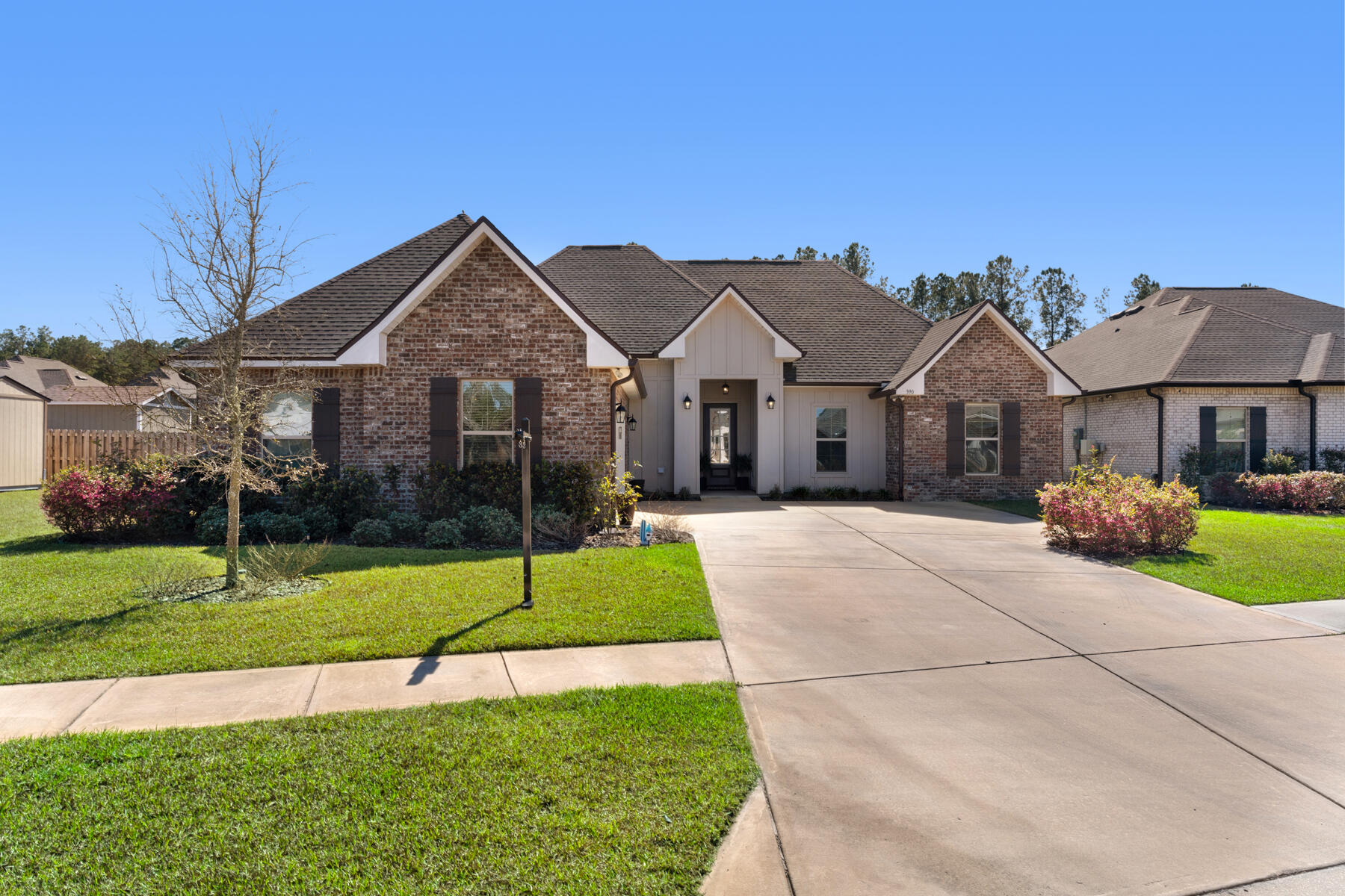 Welcome to The Trails at Hammock Bay! This gorgeous home features 4 bedrooms, 2 full bathrooms, and a spacious open-split layout with a convenient computer nook. The home has been upgraded with luxury wood-look ceramic tile flooring, stylish blinds, quartz countertops, quartz accents around the fireplace, under-cabinet lighting, and much more! Special highlights include a double vanity, garden tub, custom tiled shower with a frameless door, and a walk-in closet in the master bath. The chef's kitchen is complete with an island and walk-in pantry, while the mudroom offers a handy boot bench. Enjoy the covered patio, recessed lighting, undermount sinks, bronze plumbing fixtures, framed mirrors, and thoughtfully landscaped exterior. The home is also equipped with smoke and carbon monoxide detectors, landscaping, architectural 30-year shingles, flood lights, etc. And for those who like to keep their energy bills low, enjoy the perks of a tankless gas water heater, a gas range for all your culinary adventures, low-E MI windows for energy efficiency, and a full kitchen appliance package that's ready to serve your every whim. So come on down to The Trails at Hammock Bay, where home sweet home feels like a never-ending vacation!