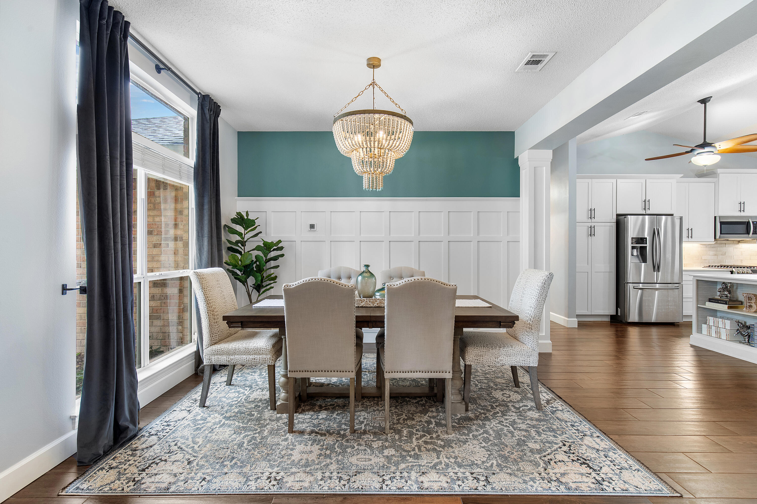 BRAND NEW ROOF installed October 2025! Discover your piece of paradise in the heart of Destin. Set in the desirable Indian Lakes community, this 3-bed/2-bath home pairs a split-bedroom layout with an airy, vaulted great room for easy everyday living and entertaining. The redesigned kitchen features white shaker cabinetry, quartz counters, an oversized island, and a full stainless suite, including a 5-burner gas range with dual convection and a French-door refrigerator with dual ice makers. A remote-controlled gas fireplace anchors the living space. Durable wood-look tile runs throughout the main areas, and both baths showcase light cabinetry with quartz tops. Practical upgrades include a tankless water heater (2017) and an updated A/C (2024).