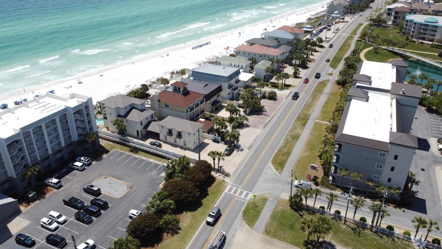 Step through the door and into a sanctuary where the gentle sounds of the ocean guide your every moment. This ground-floor condo, nestled just steps away from Miramar Beach's pristine shores, offers an escape designed for creating lasting memories with those closest to you. With its open layout featuring three well-appointed bedrooms, towering 10-foot ceilings, and elegant finishes, this home is where your beach vacation dreams become a reality.As you wander through this inviting space, you'll be greeted by the warmth of wood flooring underfoot and the expansive feel of high ceilings above. The living room, a centerpiece for relaxation and connection, flows seamlessly onto a covered patio--a perfect spot for savoring your morning coffee or winding down with evening cocktails under the starlit Florida sky.

Culinary enthusiasts will revel in the kitchen's thoughtful design, highlighted by granite countertops, sleek stainless steel appliances, and a welcoming breakfast bar, all set against the backdrop of stylish cabinetry. The master suite offers a tranquil retreat, complete with a double vanity, a spacious garden tub, and a separate shower, ensuring a serene end to each sun-filled day.

The Alerio community wraps its residents in comfort and convenience, offering a heated pool and hot tub, a delightful kids' splash pad, and a communal grilling area for outdoor enjoyment. Situated in a prime location, this condo is a stone's throw from an array of shopping, dining, and entertainment options, not to mention the soft, sugary sands of the Gulf just moments away.

This condo isn't just a place to stayit's a canvas for making memories, from family gatherings to holiday celebrations and everything in between. Furnished and ready to welcome you, this home stands as a testament to the joy of beachside living. Embrace this opportunity to own your slice of paradise, where every detail has been curated for unparalleled comfort and enjoyment. Welcome to your new coastal haven, where life's best moments await.