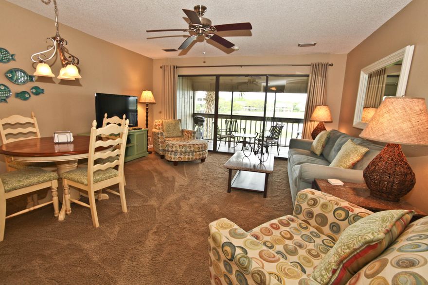 This is a terrific opportunity to own a high-volume investment condo, or a beautiful (second) home in the coveted Lakefront area of Seascape Resort. This completely remodeled unit has been available for rental for less than a year, yet has generated $20K+ in revenue. Buy now and pick up $15K to $20K spring and summer rental bookings. The condo is located about 75 yards from the beach access, near one of Seascape's five pools, and overlooks Lake Stewart and the 14th green of the Seascape golf course.