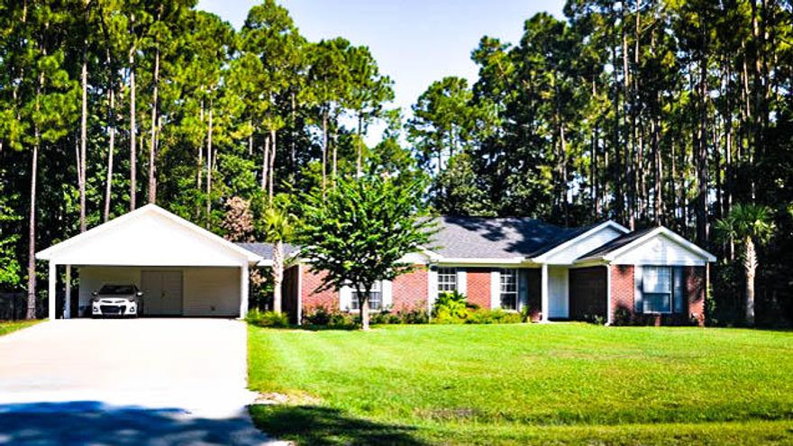 Beautiful and family friendly 3BR/2BA brick home in LaGrange Shores on a sprawling and wonderfully landscaped half acre lot. LaGrange Shores has easy access to Four Mile Creek Boat Ramp on County Road 83. Home is located very close to Sports Complex at Hammock Bay without having to pay any HOA fees! Quiet and private home is just a short drive to the pristine beaches of South Walton.Designed with a split bedroom plan, the home has gorgeous hand scraped hardwood floors throughout and tile in the wet areas. Kitchen features a large farm sink and breakfast bar. Master bath has a walk-in closet, cultured marble double vanities, and a separate shower.Recent updates include new HVAC, air handler and thermostat, new interior paint, new fence and rear deck.