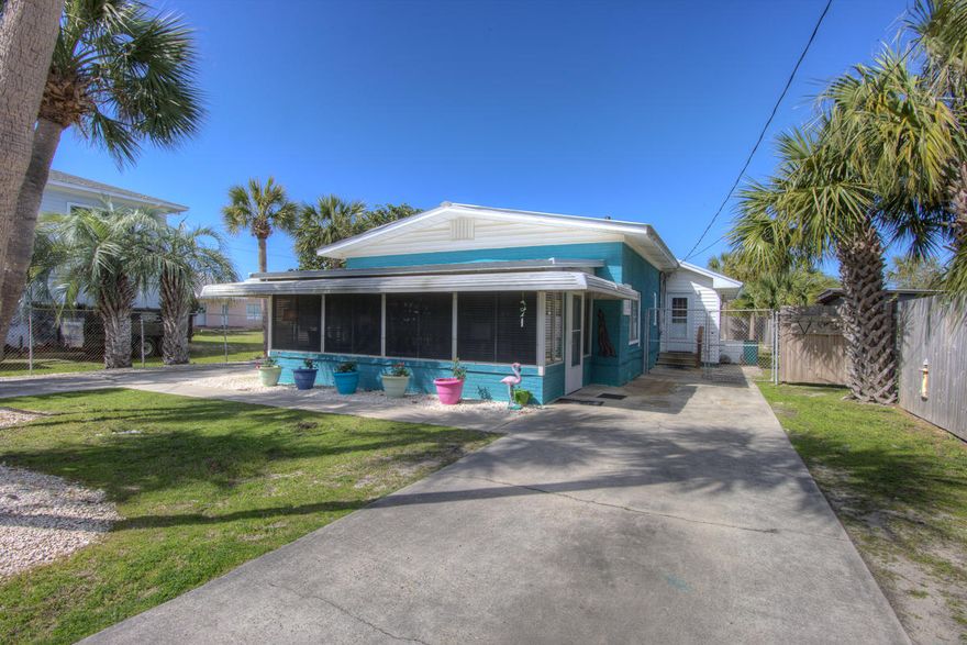 WOW, Where else could you find a 4 bedroom home in the 1st block at Bid a Wee Beach ! 1760 sq. ft. with 2 Sunrooms, One heated and cooled and One where you can just open the windows and feel the gentle Sea Breezes blow. Covered Porch out back for out door cookouts, Plus an elevated Deck with spectacular Gulf Views. 2 separate Drives that will allow plenty of extra parking and the back yard is fenced in ! Metal Roof installed in 2012 so no insurance issues and NO FLOOD zone !Recently painted and sold Fully Furnished and decorated. Turn Key move in Ready- 60 x 150 lot so plenty of room for a Pool- About 150' to the Gulf ! come and check out ''Flamingo Palms'' The electrical is upgraded along with the Plumbing. City Water and Sewer.SHORT TERM RENTALS ARE ALLOWED