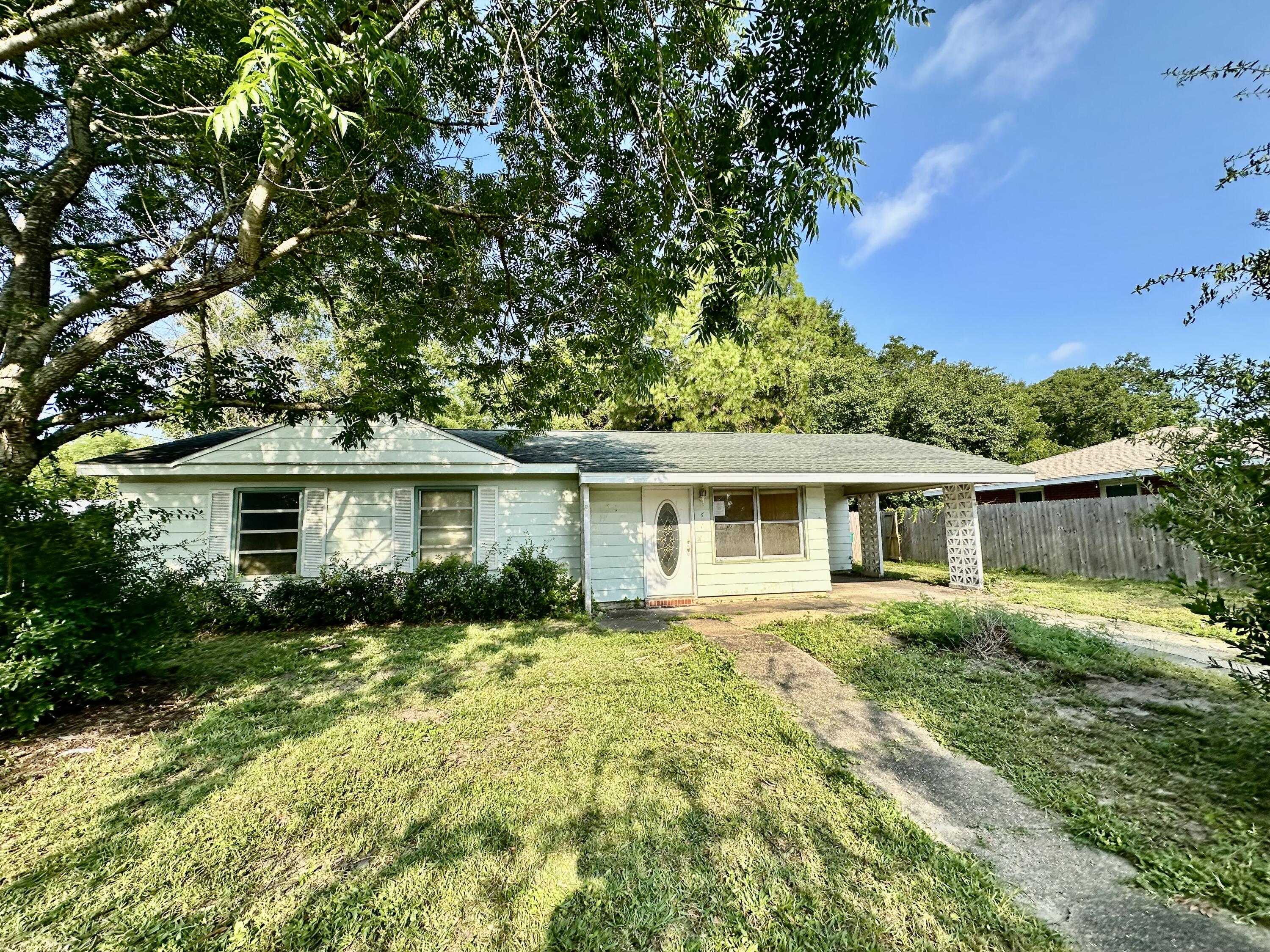 REO. Great opportunity located close to Schools, Shopping, Restaurants and more! Not only does the home have a Living Room and a Huge Family Room with a Fireplace but it also has a Large Laundry area and all sits on a HUGE LOT!! Lots of opportunity with this home! Please call for more information.