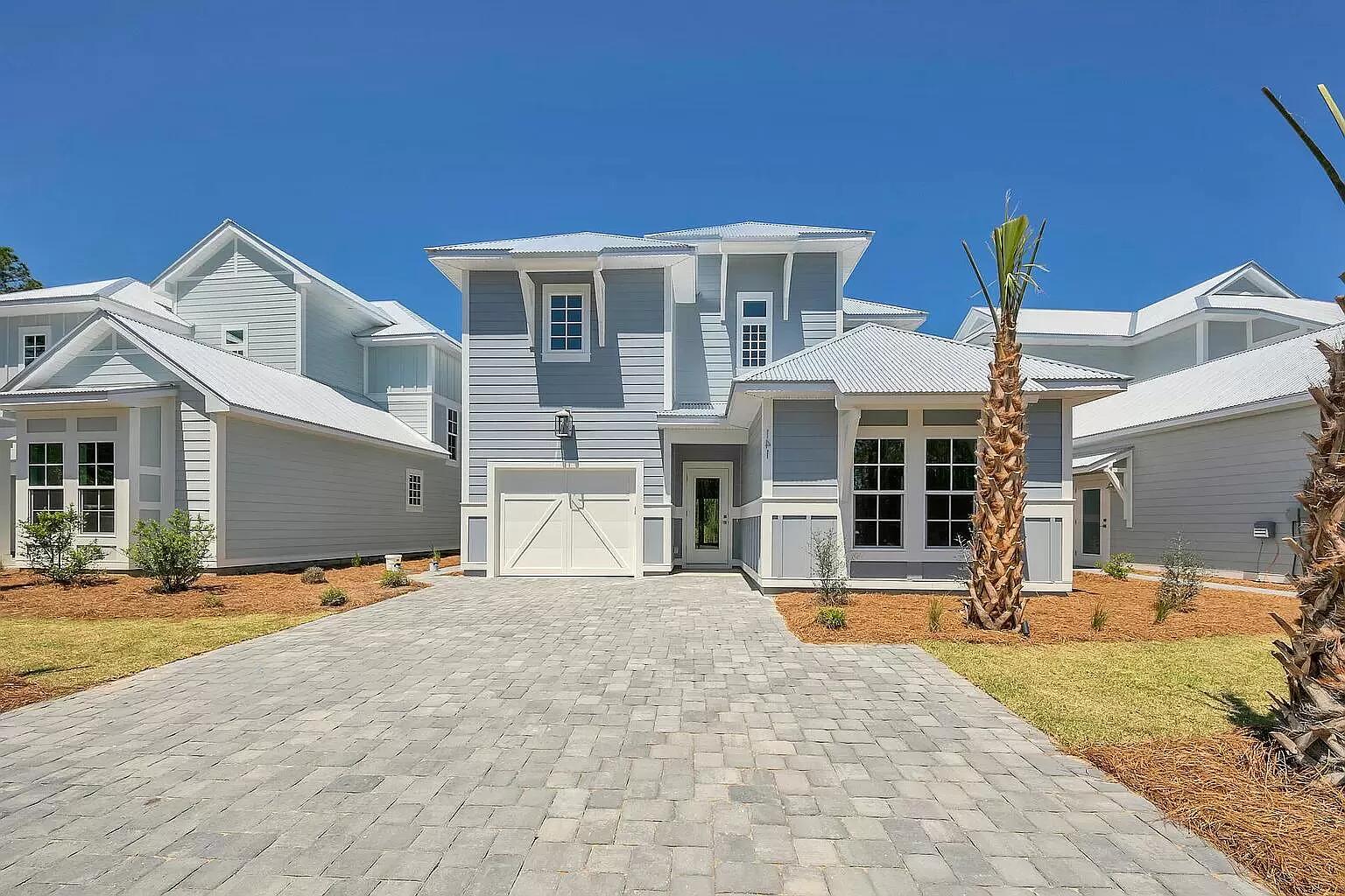 PRIME LOCATION: beach-side of US-98 - walkable or a quick drive to 30A and beaches. THE PROPERTY: A bright and shiny new home with 4 bedrooms and 3.5 baths built by one of the premier builders on 30A. Interior all re-painted. Wide open kitchen with quartz countertops, stainless appliances, upgraded lighting, and bar seating area. Open floor plan flows directly into the living room. Guest bedroom / office and full bath on the main level with 3 large bedrooms upstairs. Master bed and bath with seamless glass shower w/ designer tile upstairs. Bathrooms have quartz countertops and tasteful tile. Closets have built-in shelves and rods. 1 car garage and big driveway. PRIVACY! The house backs up directly to Preserve State lands, quiet neighborhood with minimal traffic on a no-outlet street.