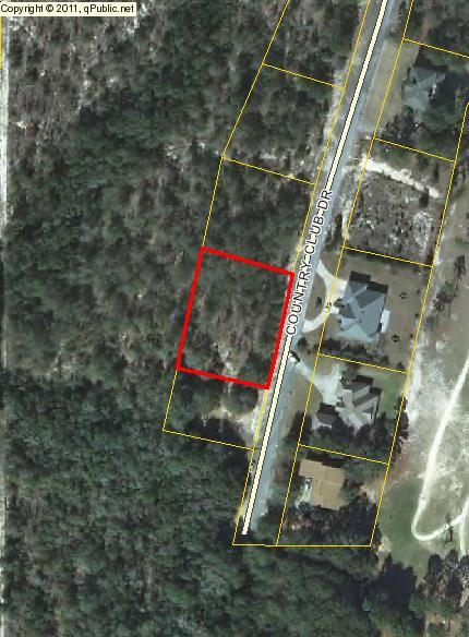 Attention golfers! Amost 165 feet of of paved road frontage. City utilities.Great place to retire, build & play golf!