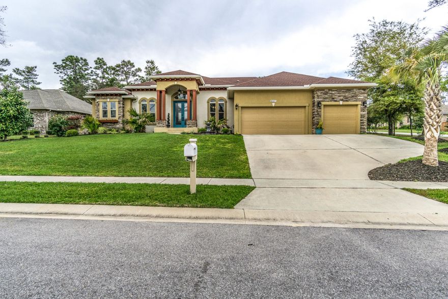 Custom Mediterranean Style Home with 3 car garage on a large corner lot in Swift Creek! This STUNNING open concept plan was designed for Indoor/Outdoor living and features a collapsible sliding door that opens to 598 sqft screen enclosed lanai with brick pavers, outdoor kitchen, hot tub and outdoor living area. The floor plan is amazing! The dramatic enytryway is flanked by an office and a formal dining room and opens into a large family room and gourmet kitchen with all the custom features you'd expect. Split bedroom concept with 2 generous sized bedrooms and a Jack and Jill Bathroom, a 3rd bedroom that has access to another full bath, and a master suite that will remind you of a grand 5 star hotel. The master bathroom is pure luxury with his and hers vanities, a massive walk in shower with ceiling mount rainhead and dual shower heads, over sized soaker tub, 2 closets, and access to the laundry room. The professional landscaping is superb and the design really gives a resort like feel. If you are looking for a truly custom one of a kind home with style and quality finishes this home is a MUST SEE. Swift Creek features a large community pool, tennis courts, basketball courts, playgrounds, and even a private fishing pond with walking trails. Call to schedule your private showing today! Live in luxury and enjoy being close to the beach and area military bases. This home is immaculate and better than new. Don't miss it!