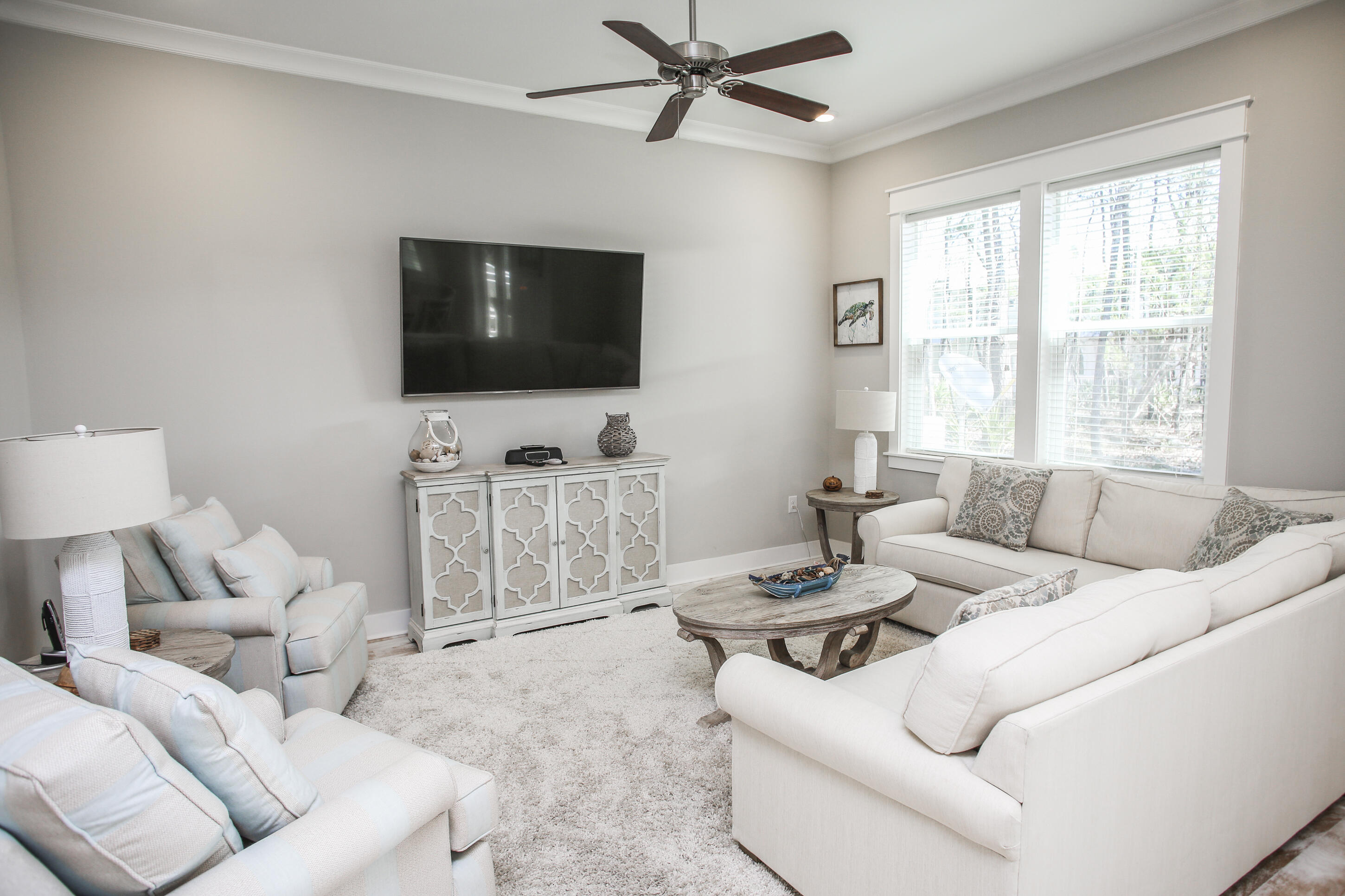 This unit is offered turn-key/fully furnished with GOLF CART INCLUDED! Strong rental numbers up to $60,000k+ gross per year. This stunning, (3) bedroom and (2.5) bathroom townhome features a premium lot location which backs up to a large preserve offering privacy and in addition a short walk to the resort style pool. Decorated with plush and high-end furnishings in natural and blue/green hues. From the light hardwood floors and premium tile throughout, professional lighting, quartz countertops, custom cabinetry to the subway glass tile backsplash, this amazing townhome is a unique find. This townhome also features a (2)-car garage attached for extra storage and parking. HOA $337 per month includes exterior insurance and maintenance, pools, gym, landscaping, secruity, and beach shuttle.