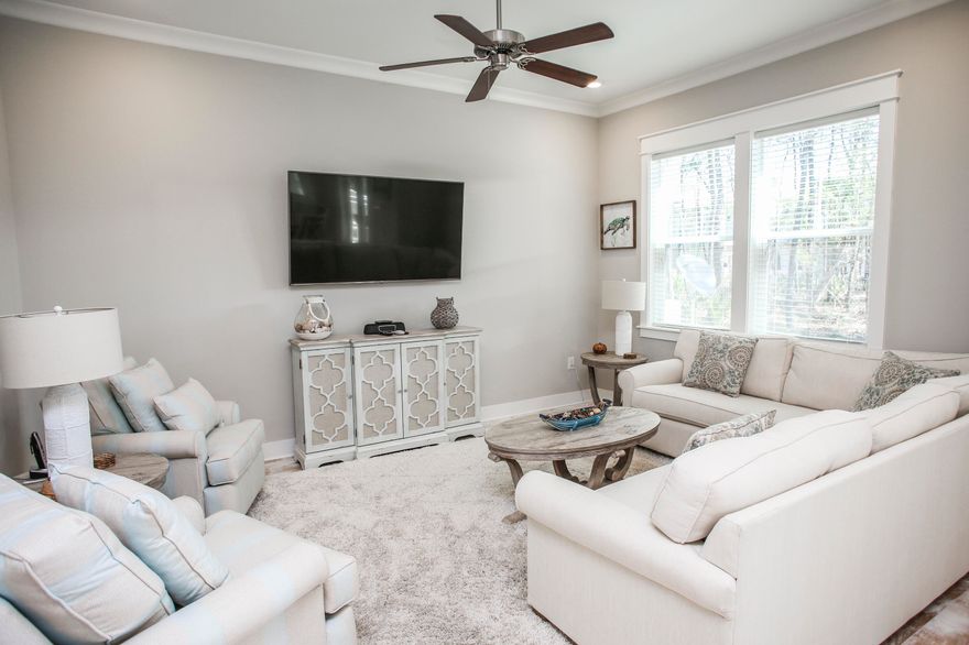 This unit is offered turn-key/fully furnished with GOLF CART INCLUDED! Strong rental numbers up to $60,000k+ gross per year. This stunning, (3) bedroom and (2.5) bathroom townhome features a premium lot location which backs up to a large preserve offering privacy and in addition a short walk to the resort style pool. Decorated with plush and high-end furnishings in natural and blue/green hues. From the light hardwood floors and premium tile throughout, professional lighting, quartz countertops, custom cabinetry to the subway glass tile backsplash, this amazing townhome is a unique find. This townhome also features a (2)-car garage attached for extra storage and parking. HOA $337 per month includes exterior insurance and maintenance, pools, gym, landscaping, secruity, and beach shuttle.