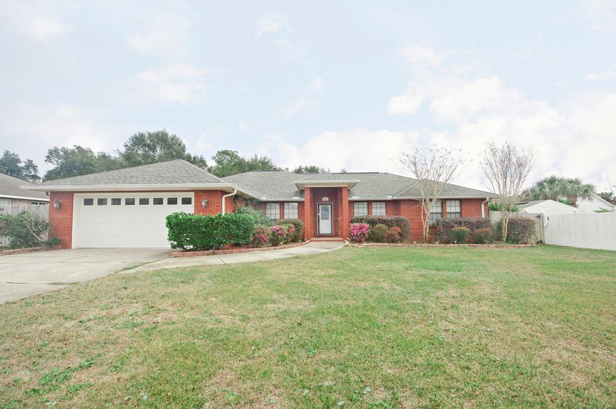 Beautiful home located in the wonderful Sound Retreat subdivision. 5 minutes from A rated schools and a short drive to the beach. This all brick home with oversized garage is situated on nearly .5 acre. The split floor plan has much to offer with 4 bedrooms and 2 baths. As you walk through the front door, the ceramic tiled foyer opens into the living room. This room features beautiful hard wood flooring and offers a fabulous fireplace to cozy up to on cool winter evenings. The spacious kitchen features a large bar - perfect for large gatherings. And you can relax in your heated and cooled Florida room.The fenced backyard is perfect for entertaining and relaxing under the pergola with plenty of room to add a pool.
