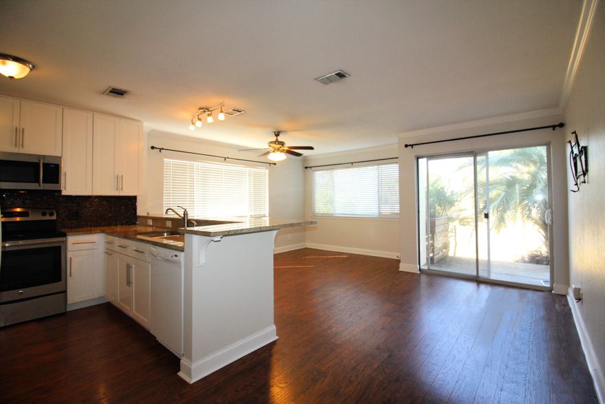 Come enjoy the coastal lifestyle of Holiday Isle! This spacious 1 bedroom, 1 bathroom condo, 1st floor corner unit with a balcony. This unit features granite countertops with a raised breakfast bar, laminated floors throughout main hallway, kitchen and living room, tile floors.  You will be walking distance to the community's gated beach access and the inlet of the East Pass at O'Steen Beach. You don't want to miss the seasonal Emerald Grand fireworks from your balcony and access to watersports  shopping and restaurants at the Harbor via water taxi at Norriego Point! Long term tenant's lease ends 6.30.22. This unit rents amazingly short term, long term or utilize it yourself! This unit won't last long!