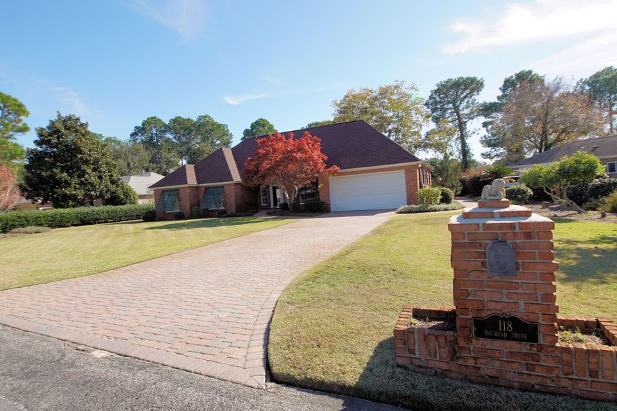 Pride of ownership is evident in this brick Contemporary. Located in the gated Southwind subdivision in Bluewater Bay. New Roof (Nov 2019). Home is large with many builder upgrades including, hardwood flooring,10 foot ceilings, crown molding throughout, gas fireplace and more. Designer kitchen features a large center island, granite counter tops, breakfast nook, cabinets galore with lots of storage, wine rack and stainless appliances.Laundry room includes front loader wash/dryer. Home warranty included.