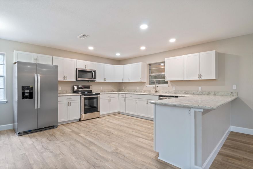 Renovated 3 Bed 2 Bath Home in Niceville! The Kitchen features NEW White Shaker Cabinets, Granite Counter-tops, and Stainless Steel Appliances. The Luxury Vinyl Plank Flooring in living and wet areas ensures low maintenance. Your family will love spending time near the fireplace in the open plan living area. New Bathroom Vanities, toilets, and Fixtures. Enjoy entertaining in the back yard or on large enclosed patio ! This home is Move In Ready with fresh paint, new shower and much more! Two car garage. Copper wiring. Great neighborhood with easy access to Hulburt, Eglin, Destin, fort walton beaches and amenities. Schedule your tour today! OPEN HOUSE 11-2pm Wednesday 10-23