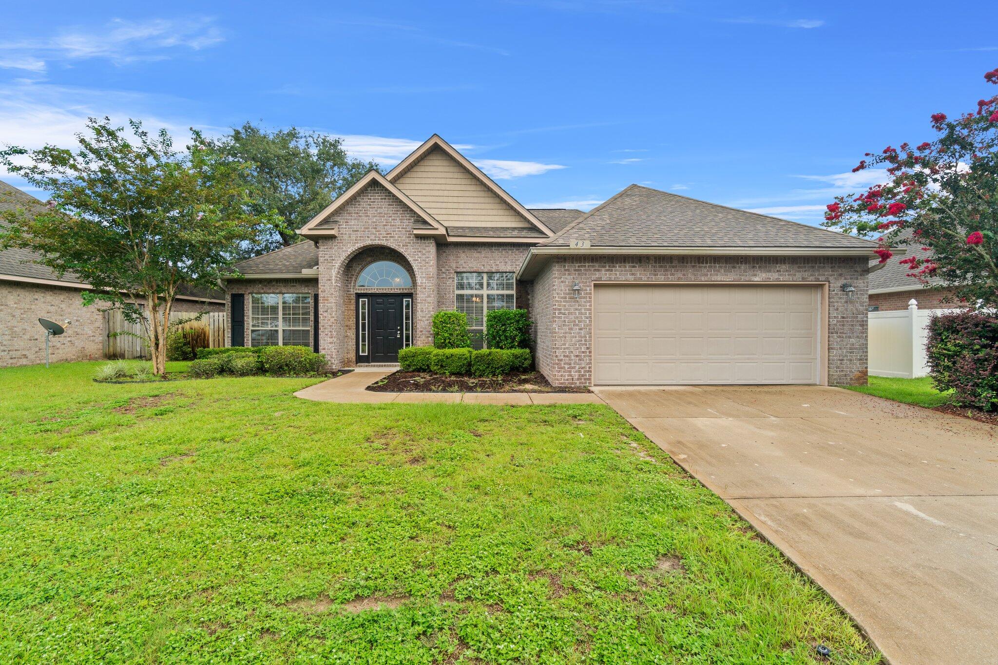 This 3 bd/2ba beautiful all brick ranch located in Peach Creek is ready to call home. With a soaring 16ft. ceiling in the dining room right off the entrance this is sure to stun. This split bedroom ranch plan , ''Glenhurst'' offers a formal living room or study, and formal dining room off the grand entrance. This extra large kitchen with a raised breakfast bar is open to the 21x19 family room that has a wood burning fireplace. LVP flooring throughout, stainless steel appliances, fenced back yard and 2 car garage!This is a popular established neighborhood in which STR is not allowed.
