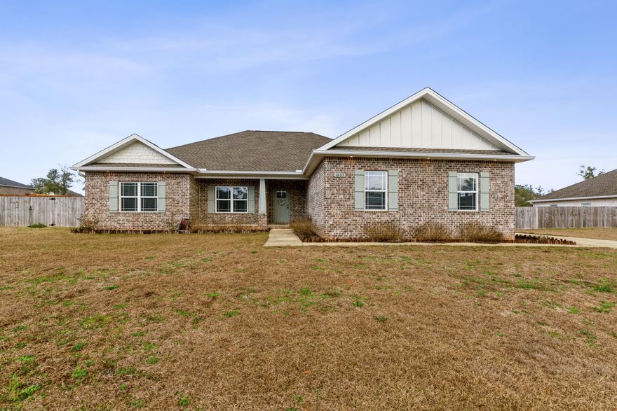 Practically new construction on a 1/2 acre in Baker, built in 2020, in pristine condition! 4 bedrooms, 2 bathrooms plus a large flex/office room. Gorgeous stacked-stone electric fireplace in the living room. Custom cabinetry, granite countertops, LVP flooring in all main areas, and bathrooms with carpet in the bedrooms. Open floor plan with a large island that overlooks the living room. Dovetail white cabinets with dark stain island. Full stainless appliance suite. The master bathroom has a lovely, tiled walk-in shower with a glass enclosure, a large soaking tub with a tiled backsplash, double vanity. A massive covered back porch that overlooks the huge backyard with irrigation, and a privacy fence! No HOA! Call to schedule your appointment!