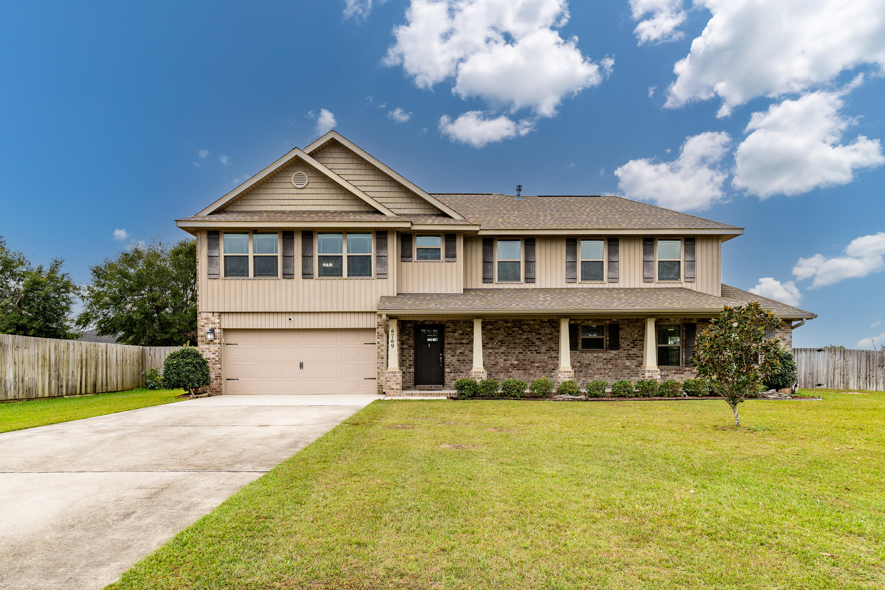 Just minutes from I-10 and HWY-90 and 15 minutes to Pensacola FL is a well-designed two-story residence nestled in a serene cul-de-sac. The generous living room is bathed in natural light, creating a warm and welcoming atmosphere. The well-appointed kitchen features stainless steel appliances, ample counter space, and a cozy breakfast nook, perfect for casual meals. Enjoy the privacy of a generously sized master bedroom, complete with an en-suite bathroom featuring a double vanity and a relaxing soaking tub. Two additional bedrooms have easy access to a full bathroom. Step outside to the backyard oasis, where you can unwind on the patio, perfect for summer barbecues or enjoying morning coffee. This home is just minutes away from local parks, schools, shopping, and dining options.