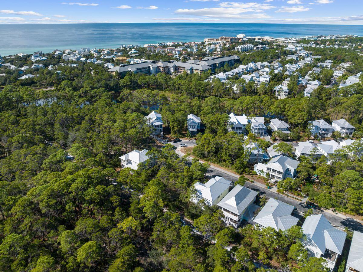 Tucked within the gated section of Lakeside at Blue Mountain Beach, this lot exudes serenity against the backdrop of Point Washington State Forest, just a short walk away from the relaxing Gulf waves and sandy shoreline. Whether intended as a second home or vacation rental, tranquility reigns supreme here. Discover a community pool, playground and the enigmatic Redfish Lake bridge. Plus, it's just a leisurely bike ride or relaxed stroll to Blue Mountain Beach regional access, with dining and shops like Blue Mountain Creamery and Red Fish Village mere moments away. Building restrictions permit a two-story main house (two-and-a-half stories with a tower) of up to 3,400 Sq.Ft. and separate 580 Sq.Ft. carriage house, opening doors to boundless possibilities. Enjoy coastal living in the heart of Blue Mountain Beach with close proximity to Grayton Beach fun.