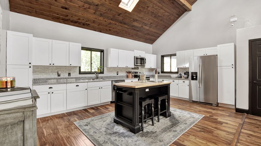 Back on the market, financing fell through. This one of a kind property sits on just over an acre, with a pond out back and golf course views of Dogwood Lakes Golf Course. With 4 bedrooms, 3.5 baths and over 2,800 sq. ft of living space, this home is perfect for getting away from it all, or entertaining. The kitchen/living area is open concept, with two bedrooms on the first floor, and a Florida room. There is a second living area on the first floor with picture windows to bring in lots of natural light. Two additional bedrooms and a bathroom are upstairs. Current updates include new hardwood flooring on the first level, new kitchen cabinets, countertops, backsplash, kitchen appliances, new toilets, new Amana air conditioner.