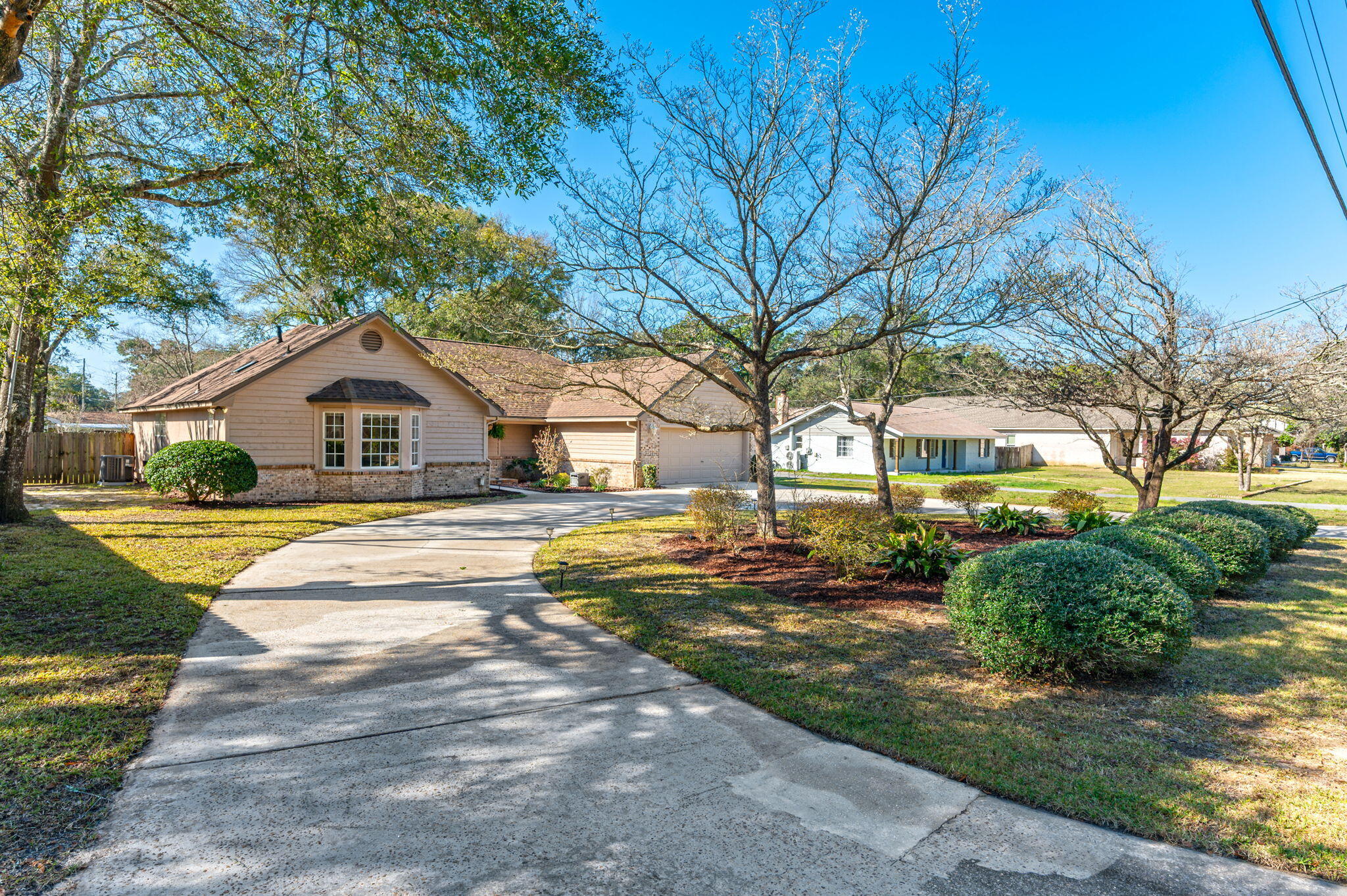 Welcome to this beautifully upgraded 4-bedroom, 2-bathroom home, offering the perfect blend of style, comfort, and functionality. Step inside to find a spacious living room featuring a cozy gas fireplace and a wet bar, ideal for entertaining guests or relaxing with family. The kitchen is a dream come true, boasting custom backsplash, stainless steel appliances, a gas stove, quartz countertops, and a large island, providing ample space for gatherings.The oversized primary suite is a true retreat, complete with a tiled stand-up shower, double vanity, and a walk-in closet. Each of the additional bedrooms offers plenty of space, making this home perfect for families or guests. Roof 2022, HVAC 2024, Tankless Water Heater 2012 Step outside to enjoy the fully fenced backyard with a screened-in porch, perfect for unwinding and taking in the peaceful surroundings. Additional features include a whole-house generator for peace of mind and a sprinkler system on a well to keep the yard lush year-round.