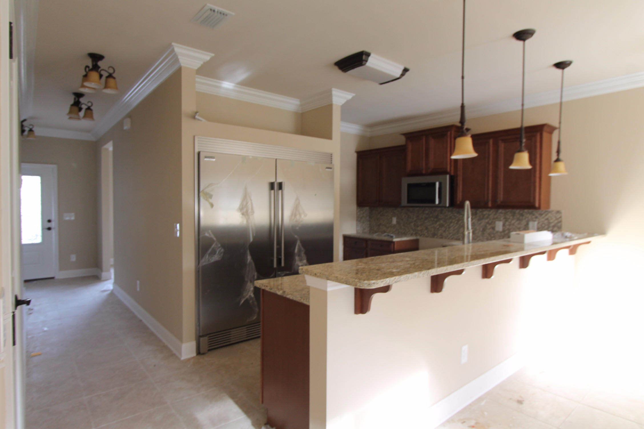 Brand new construction started on 8/15/2016. Awesome plan offered by a multiple award winning builder. This 2 Story (master is on first floor), 3/3.5 home has super curb appeal. There are 9 ft. ceilings w/ impressive crown molding, and 5 1/4'' baseboard throughout the main living areas and master. As you approach the front of the home, you will be quite impressed. The covered porch is very welcoming, and the attractive leaded glass door makes for a grand entrance. The formal dining room is at the left of the home's front. As you continue down the hallway, just past the stairwell, you will then enter the chef's delight kitchen which boasts maple cabinetry,custom cabinetry with crown moulding and plant ledges, 3 cm. granite countertops,