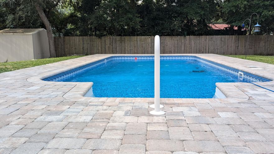 Beautiful all-brick home with a pool in Robledal Estates! This gorgeous home is move-in ready and perfect for entertaining, with a covered patio, large paved pool deck, and a shallow (max depth 5') pool that's just begging for some water games.Step inside and enjoy the elegance of this split-floorplan design. The great room  features recessed lighting, wood-burning fireplace, and artwork niche.The master suite features an amazing  double trey ceiling, direct access to the backyard,  and ensuite with garden tub and separate shower.The oversized garage has a separate storage room and access to the half bath.Formal dining, at the bar, or breakfast nook? It's your call. So much more! You have to see it to appreciate it! Schedule your showing today!