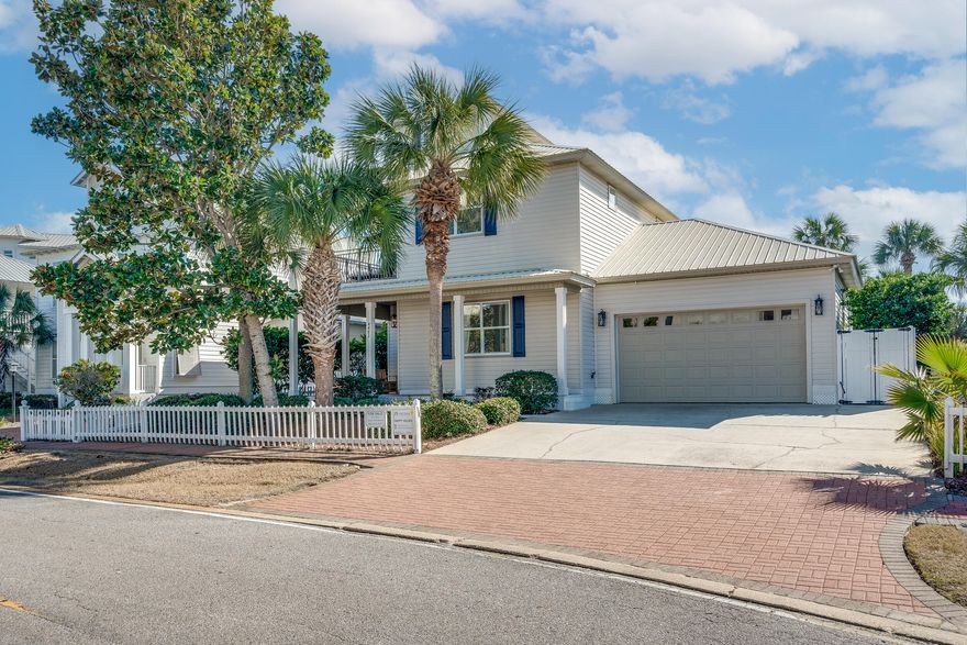 Welcome to 'Happy Hours', a 5BR home in Crystal Shores, located directly across from the Gulf of Mexico's white sands and emerald waters. More than a vacation home, it's a gateway to cherished moments and a dream lifestyle.The heart of this home is its first-floor open-concept living area, where an updated kitchen with stainless steel appliances and quartz countertops meets a dining space and a living room anchored by a large fireplace. This harmonious blend of spaces is perfect for culinary creations and fireside gatherings.Each bedroom in 'Happy Hours' is a uniquely crafted sanctuary, offering comfort and style. On the ground floor, a spacious bedroom features direct access to a versatile bathroom, doubling as the powder room, combining convenience with privacy.