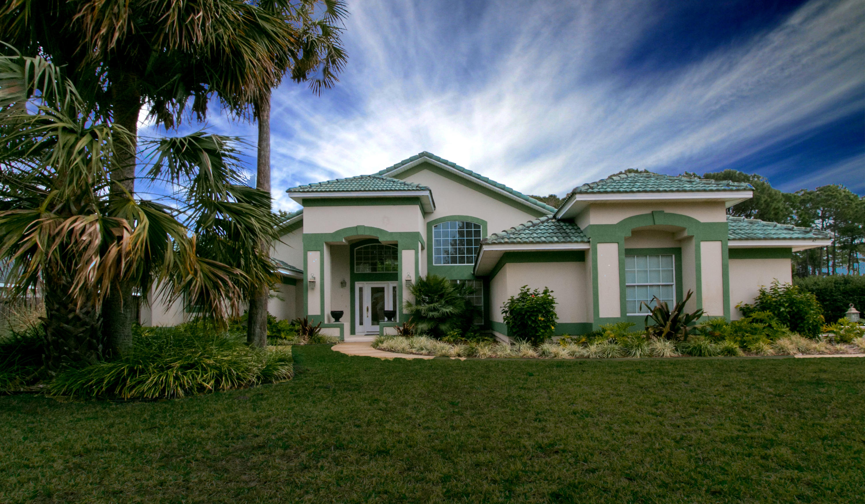 Discover this quintessential Florida POOL home tucked away on a perfect lot in the highly desirable Indian Bayou Golf Club community. Central to beaches, shopping, dining, and golf, yet totally private! Gorgeous palms and mature landscaping draw you in from the quiet residential street to an open concept floor plan featuring 18 foot ceilings, formal dining and living rooms, great room with gas fireplace adjacent to the eat-in kitchen with GE Profile STAINLESS appliance suite all overlooking the backyard oasis! A gracious covered patio, plumbed with natural gas for grilling, flows toward the plunge-depth, freeform gunite POOL with water feature, and a fully fenced yard backing to undeveloped, natural open space. Owner's retreat highlighted by sitting area, sliding doors to the pool...
