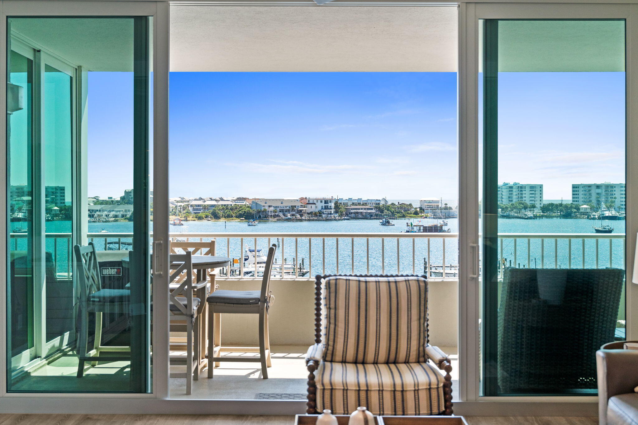 Destin Yacht Club C303 - Renovated Luxury with Gulf & Harbor Views--Completely renovated in 2024, Destin Yacht Club C303 is a stunning, turn-key condo offering breathtaking views of both the Destin Harbor and the Gulf. Every detail has been thoughtfully updated, making it move-in ready for luxurious coastal living.Key Features:*Fully Furnished (excluding personal items - see list)*Included Boat Slip with motorized lift*2024 Sea-Doo Fish Pro 170 Jet Ski (only 90 hours of use)*Spacious Balcony with:*Counter-height Polywood dining set*High-quality deep seating furniture*Weber electric grillInterior Highlights:*Kitchen:*Two pantries and custom organization systems*Premium KitchenAid appliances*Quartz countertops and LED lighting Living Room:
*Leather power reclining sofa and loveseat
*Built-in bar with wine & beverage fridges
*Motorized shades on harbor-facing windows
*Plantation shutters on north-facing windows
Laundry:
*Brand new LG washer/dryer with pedestals
Storage:
*Ample in-unit storage with organization
*Dedicated owner's storage off the dock - perfect for fishing gear or paddleboards
Community Amenities at Destin Yacht Club:
*Vibrant and welcoming social community
*Indoor & outdoor bar areas
*State-of-the-art gym overlooking the harbor
*Community room with kitchen and dining area
*Pool table & grand piano
*Multiple lounging and seating spaces
*Non rental community
Don't miss the video tab and the floor plan under the photo section of the listing. The floor plan has been altered from the original to make better use of the space.
Enjoy direct access to the Destin HarborWalk, where restaurants, live music, and shopping are just steps away. This is more than a condo, it's a lifestyle.