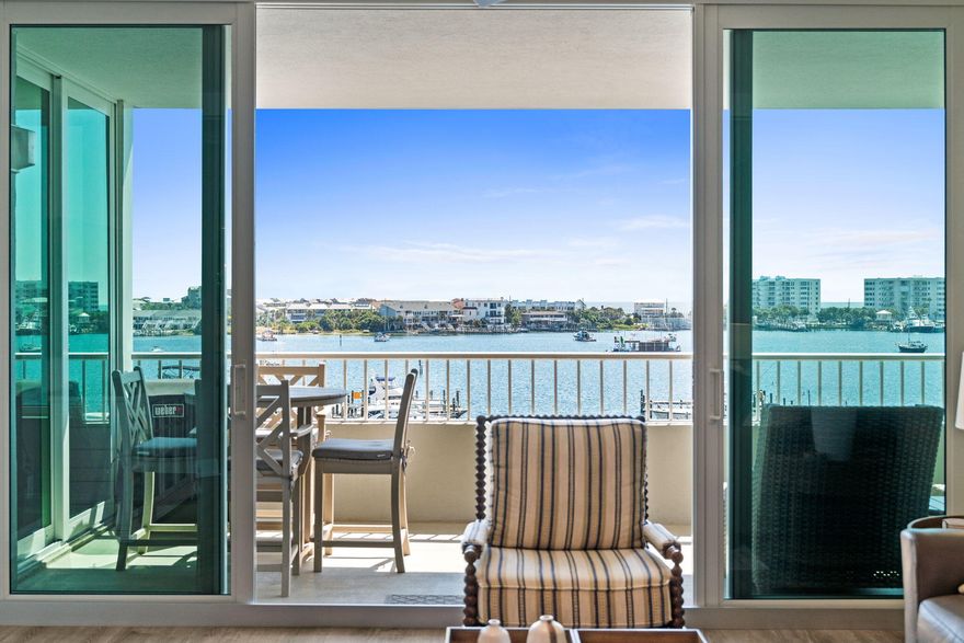 Destin Yacht Club C303 - Renovated Luxury with Gulf & Harbor Views--Completely renovated in 2024, Destin Yacht Club C303 is a stunning, turn-key condo offering breathtaking views of both the Destin Harbor and the Gulf. Every detail has been thoughtfully updated, making it move-in ready for luxurious coastal living.Key Features:*Fully Furnished (excluding personal items - see list)*Included Boat Slip with motorized lift*2024 Sea-Doo Fish Pro 170 Jet Ski (only 90 hours of use)*Spacious Balcony with:*Counter-height Polywood dining set*High-quality deep seating furniture*Weber electric grillInterior Highlights:*Kitchen:*Two pantries and custom organization systems*Premium KitchenAid appliances*Quartz countertops and LED lighting Living Room:
*Leather power reclining sofa and loveseat
*Built-in bar with wine & beverage fridges
*Motorized shades on harbor-facing windows
*Plantation shutters on north-facing windows
Laundry:
*Brand new LG washer/dryer with pedestals
Storage:
*Ample in-unit storage with organization
*Dedicated owner's storage off the dock - perfect for fishing gear or paddleboards

Community Amenities at Destin Yacht Club:
*Vibrant and welcoming social community
*Indoor & outdoor bar areas
*State-of-the-art gym overlooking the harbor
*Community room with kitchen and dining area
*Pool table & grand piano
*Multiple lounging and seating spaces
*Non rental community

Don't miss the video tab and the floor plan under the photo section of the listing.  The floor plan has been altered from the original to make better use of the space.

Enjoy direct access to the Destin HarborWalk, where restaurants, live music, and shopping are just steps away. This is more than a condo, it's a lifestyle.
