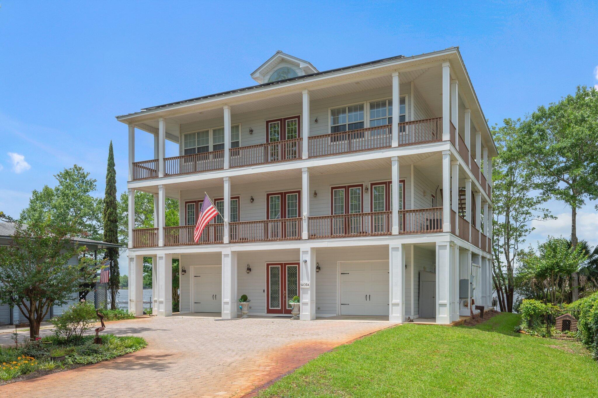 Waterfront Living at Its Finest on Boggy BayouExperience the ultimate in coastal living with this custom-built, three-level home offering 82 feet of deep water access on the sought-after Boggy Bayou. Enjoy breathtaking water views from the master suite, living room, and dining area. Thoughtfully designed for comfort and entertaining, this home features: A private dock for boating or relaxing, elevator access to all levels, multiple porches and covered outdoor areas perfect for gatherings, generous parking and ample storage throughout. The spacious downstairs area is ideal for hosting, with covered space made for hours of enjoyment rain or shine. Lovingly maintained and centrally located, this waterfront gem offers a rare combination of luxury, convenience, and natural beauty. Home has solar panels and will be paid off prior to closing. Home also has a generator. Flood insurance required.