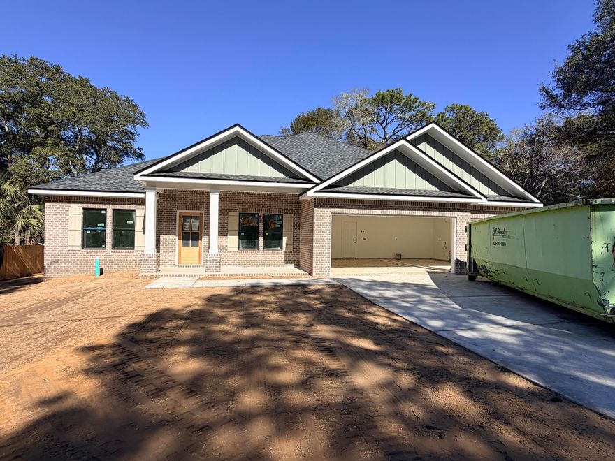 ***BUILDER SUPERBOWL LX INCENTIVE!!!***  Currently under construction, this stunning Craftsman-style residence brings a sought-after modern floor plan to the established charm of Hillcrest Avenue. Boasting five spacious bedrooms and three full bathrooms across a thoughtfully designed 2,656-square-foot layout, this home is engineered for both sophisticated entertaining and comfortable daily living. The heart of the home will feature a chef-inspired kitchen with premium quartz countertops, a professional gas range, custom soft-close cabinetry, and a deep farmhouse sink, all centered around a functional island and a massive walk-in pantry. High-end luxury vinyl plank flooring will flow seamlessly through the main living areas, accented by elegant crown molding and soaring vaulted ceilings that enhance the home's open, airy feel. The split-bedroom floor plan ensures maximum privacy for the primary suite, which serves as a true retreat with its spa-like garden tub and dual-vanity bath. Efficiency and safety are built-in from the ground up, featuring a tankless gas water heater, natural gas heating, and hurricane-rated protection. A standout feature of this property is the oversized three-car garagea rare find in Valparaisoproviding ample space for vehicles, a boat, or a workshop. Ideally located just minutes from the gates of Eglin AFB, Lincoln Park's public boat ramp, and the dining and shopping of Niceville, this home offers a premium lifestyle in a quiet, central location. Secure this home now and watch your dream come to life! Photos are of the same floor plan built by the same builder, some fixtures and finishes may not be the same.