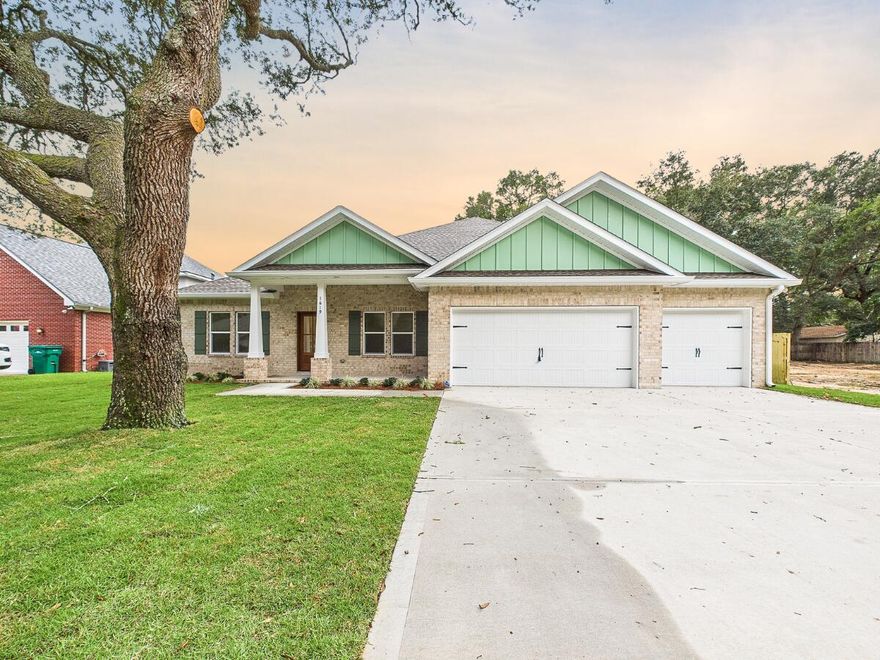 Currently under construction, this stunning Craftsman-style residence brings a sought-after modern floor plan to the established charm of Hillcrest Avenue. Boasting five spacious bedrooms and three full bathrooms across a thoughtfully designed 2,656-square-foot layout, this home is engineered for both sophisticated entertaining and comfortable daily living. The heart of the home will feature a chef-inspired kitchen with premium quartz countertops, a professional gas range, custom soft-close cabinetry, and a deep farmhouse sink, all centered around a functional island and a massive walk-in pantry. High-end luxury vinyl plank flooring will flow seamlessly through the main living areas, accented by elegant crown molding and soaring vaulted ceilings that enhance the home's open, airy feel. The split-bedroom floor plan ensures maximum privacy for the primary suite, which serves as a true retreat with its spa-like garden tub and dual-vanity bath. Efficiency and safety are built-in from the ground up, featuring a tankless gas water heater, natural gas heating, and hurricane-rated protection. A standout feature of this property is the oversized three-car garagea rare find in Valparaisoproviding ample space for vehicles, a boat, or a workshop. Ideally located just minutes from the gates of Eglin AFB, Lincoln Park's public boat ramp, and the dining and shopping of Niceville, this home offers a premium lifestyle in a quiet, central location. Secure this home now and watch your dream come to life! Photos are of the same floor plan built by the same builder, some fixtures and finishes may not be the same.