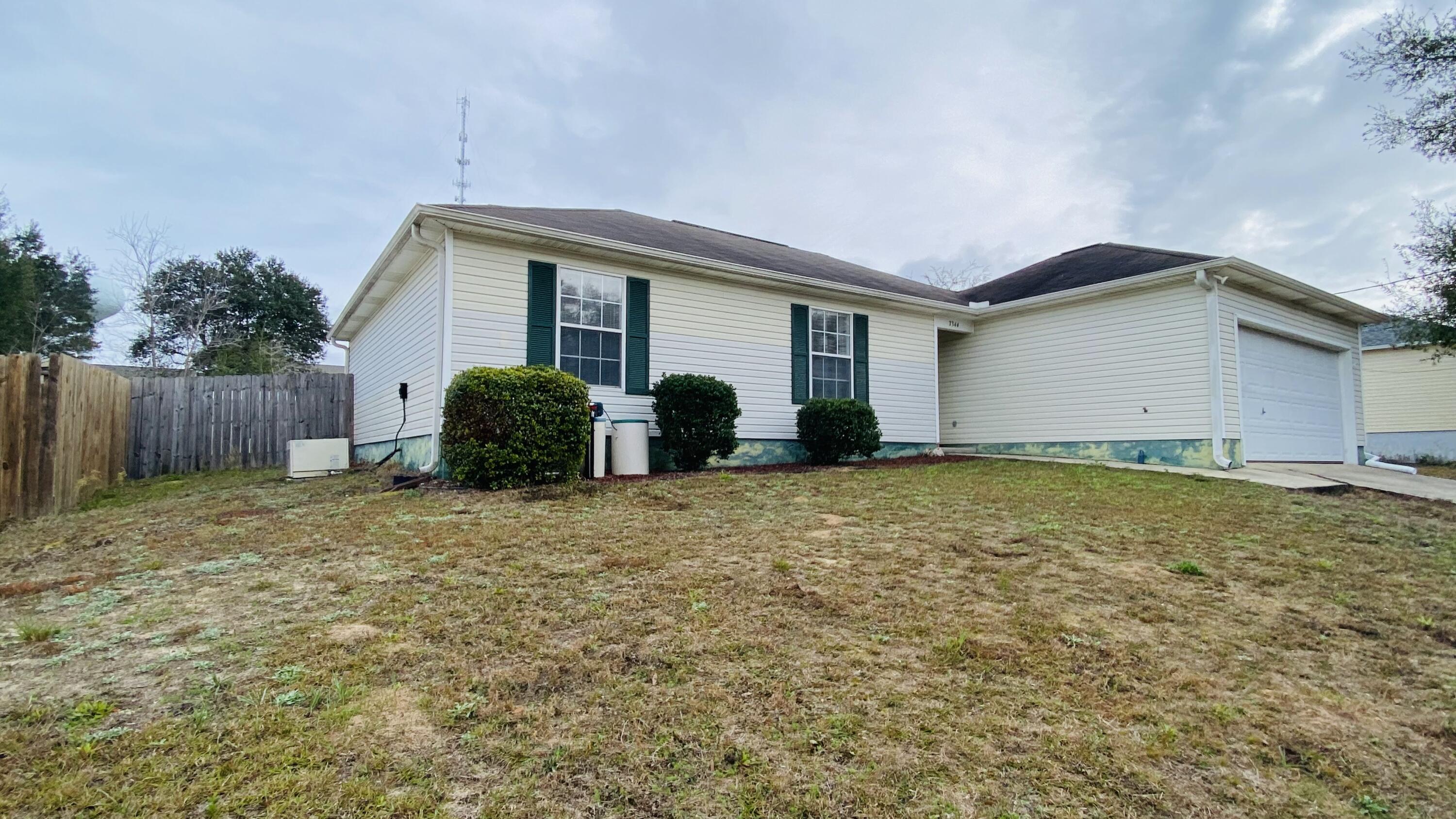 Charming Move In Ready 3-bedroom 2 bath, 2 car garage Patio home (smoke free/pet free), just off Hwy 87. Stainless Steel Kitchen appliances updated Hot water heater (2019), laminate wood flooring (2020) in Great room with cathedral ceilings and updated lighting in several rooms. Custom shelves in dining room, bedroom and garage. SEE FEATURE SHEET FOR MORE INFO The large backyard is with privacy fenced. Easy access to I-10, Whiting Field, Navarre and the beaches, Ye Old Brother's Brewery and the public boat ramp for East Bay River/East Bay... Make sure you add this quaint home to your Must SEE today, List!
