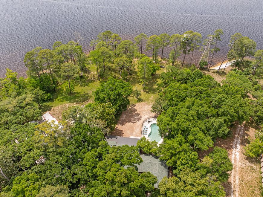 Rare Bayfront Opportunity - 1.69 Acres with Stunning Views of Perdido BayWelcome to ''Paradise'' -- a true waterfront retreat offering 1.69 acres of privacy and natural beauty with 115 feet of bay frontage. Bring your kayak, add a boat slip, and enjoy the luxury of wide-open water views combined with the rare benefit of large acreage.The home blends charm and function with a split floor plan, 3 bedrooms, and 2 full baths. The fully remodeled kitchen is a standout, featuring high-end finishes, a full-size wine fridge, and a large walk-in pantry with a window for natural light. A bright sitting area extends from the kitchen, ideal for entertaining or relaxing.Enjoy peaceful mornings and sunset views from the air-conditioned sunroom or step into the screened porch. The living room features a wood-burning fireplace, and the master suite includes a walk-in closet, tiled shower, and private garage access.

Additional features:

In-ground pool with safety fencing

Oversized garage/workshop (double deep)

Mature landscaping with beautiful trees

No HOA

Dock pilings in place for future slip or dock rebuild

Andersen double-pane windows and quality block construction with cedar and stucco siding

Tucked away just south of Lillian Hwy, this rare bayfront retreat offers the privacy of acreage with direct access to the water  a true Emerald Coast gem.


