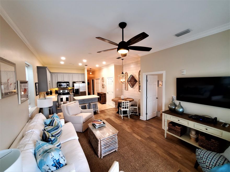 STILL TAKING BACKUP OFFERS - EASY SHOW. Beautifully upgraded end unit condo with additional windows, 10' ceilings with crown molding in main area, upgraded painted cabinets with under and above accent lighting, stainless steel appliances and mosaic tile backsplash in kitchen. Travertine and luxury wood vinyl flooring throughout. Shiplap accent walls in the cafe area and the master vanity add a handsome touch. This unit has only been rented to friends and family but is being sold fully furnished and would make a perfect rental income, second home or residence. The current owners love the easy access for loading/ uploading and not having to deal with stairs or elevators. Seagrove Highlands is gated and tucked away from all the 30A hoopla, but is close and convenient to beach access, bike path, neighboring restaurants, shops, entertainment, and everything the 30A lifestyle has to offer. Come and see. This well cared for upgraded unit is waiting for you.