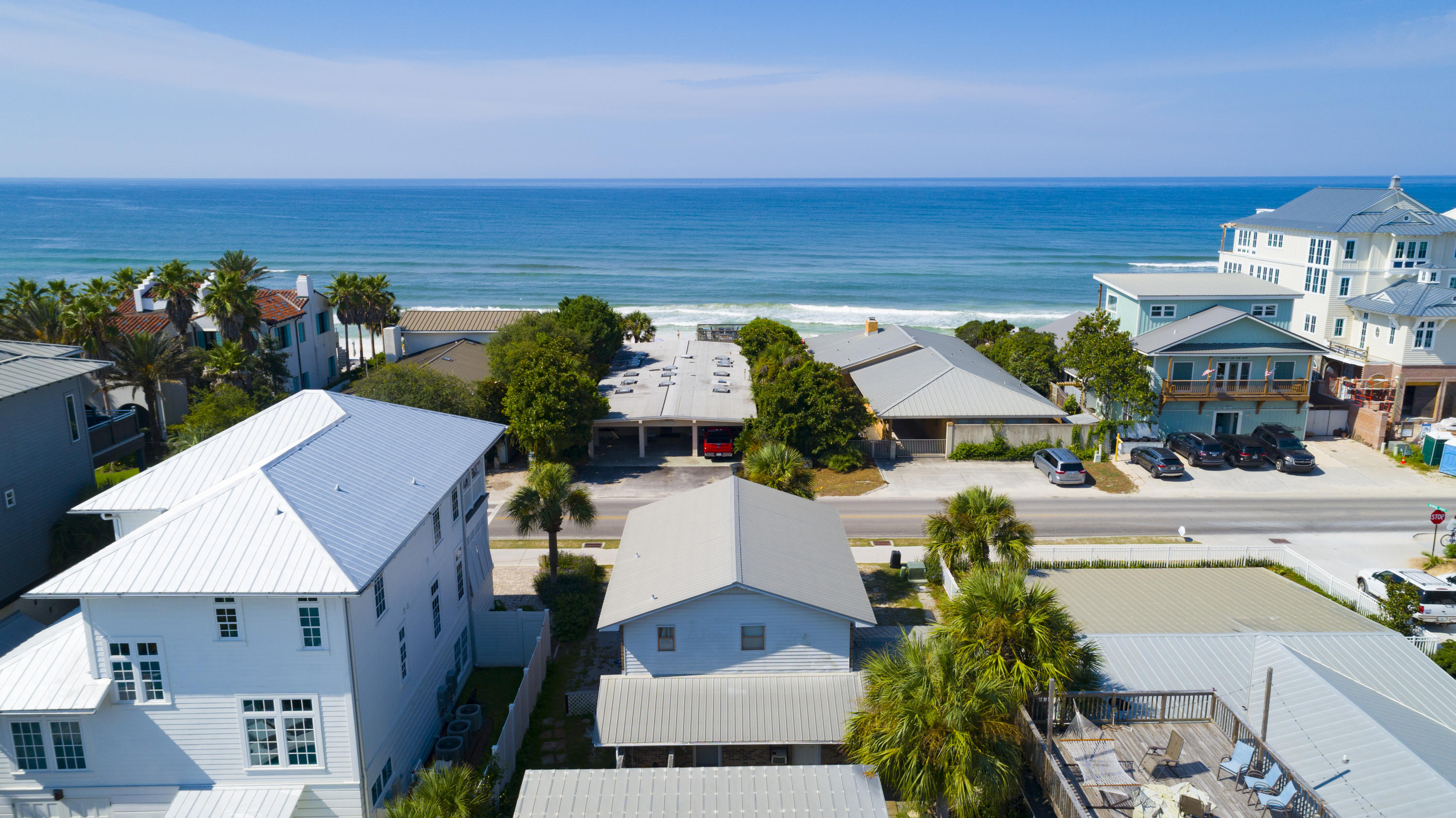 Travel back to ''Of Days Gone By'' when Old Seagrove was just beginning to become a beach town by the Gulf of Mexico. Even before Seaside became the world famous walking community, this concrete block guest house was built by the present owners parents in 1962. They could attest to their structure standing strong during storms and their walls hold dear memories of family, cousins and friends. In 1986 they constructed the main house in front facing Scenic 30-A. They have replaced the roof and have kept appliances in good running order during the years. Remember the good ole days? Come sit a spell on the front porch or balcony to enjoy life at the Beach directly across the street! This property is one back from Gulf Front and many New Construction homes are being built, within 1 Block of