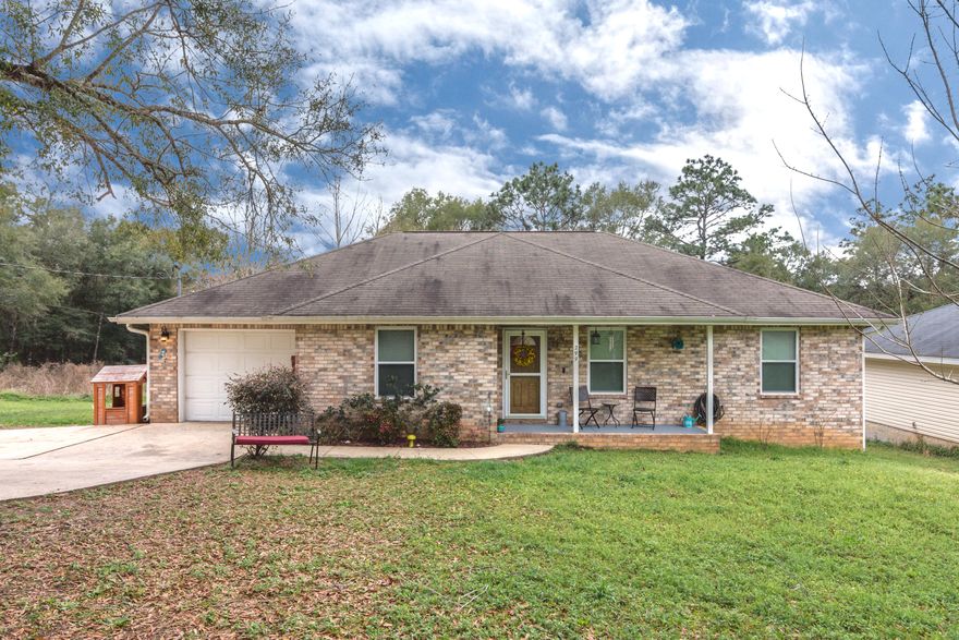 This gem is a must see!! With NEW water heater in 2017, A/C in 2016, All new energy efficient windows in 2015. Upon entering this home you will notice the cathedral ceiling that accents the living area. This 3 bedroom 2 bath home is located in a corner lot, nestled on almost 3/4 an acre. Centrally located this home is close to the center of town, HWY 90, and RT 85. The 1488 square feet never felt so big with a split floor plan, spacious kitchen and laundry room there is lots of storage. This back deck oversees a private and wooded area and is a perfect place for entertaining guest, or just relaxing, and the large fenced in area is good for children or pets to play.