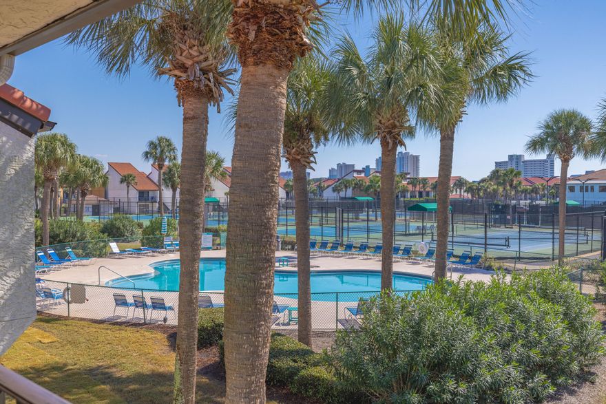 Discover one of PCB's most desirable gated beach resorts! This exceptional, second floor, tennis villa is located in the exclusive Edgewater Resort. Nestled in a vibrant beach, tennis, and golf community this villa offers a seamless open concept, living dining & kitchen area perfect for both relaxation & entertaining. The split bedroom floor plan enhances privacy while the master bedroom & main living area open to a generous balcony with serene pool views. Edgewater Resort is a premium, full service destination, along the iconic white sands of the Gulf of Mexico, featuring unparalleled amenities. Enjoy an impressive 11,800 square-foot lagoon pool with cascading waterfalls, 9 heated pools (seasonal), 4 hot tubs, & seasonal poolside activities w/live music. SEE ADDITIONAL REMARKS... The resorts dining options include oceans, a full service restaurant and bar, a Starbucks cafe, ice cream parlor and a casual pizza shack. Additional perks include a spa, fitness center, nine hole executive golf course, and 11 lighted tennis and basketball courts. This villa is an ideal choice for those seeking a wonderful, relaxed, beach lifestyle, offering everything needed for a perfect coastal getaway.
