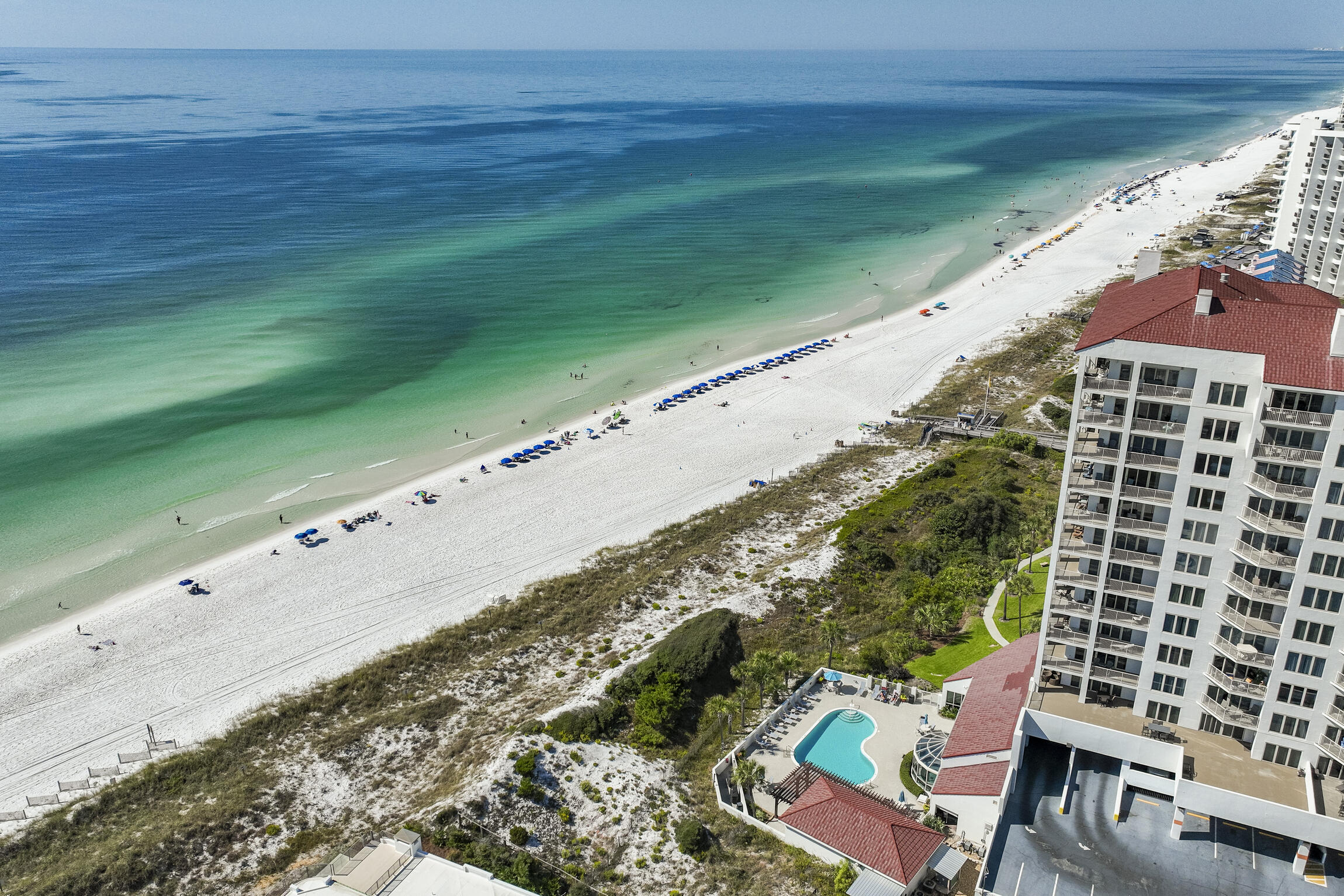 This east-facing unit offers a daily spectacle of Florida's stunning pink and orange sunrises. Easterly gulf views and a prime location await! The unit offers a fantastic canvas for customization and modernization, allowing you to create a stylish beach escape. The prime location and incredible views make this property a must-see for those looking to personalize their piece of paradise. Don't miss this chance to create your dream beach getaway. Located in the 52 acre resort of Tops'l with all the best amenities with added membership fees. Beach Manor has 5 levels of undercover parking. No assigned parking