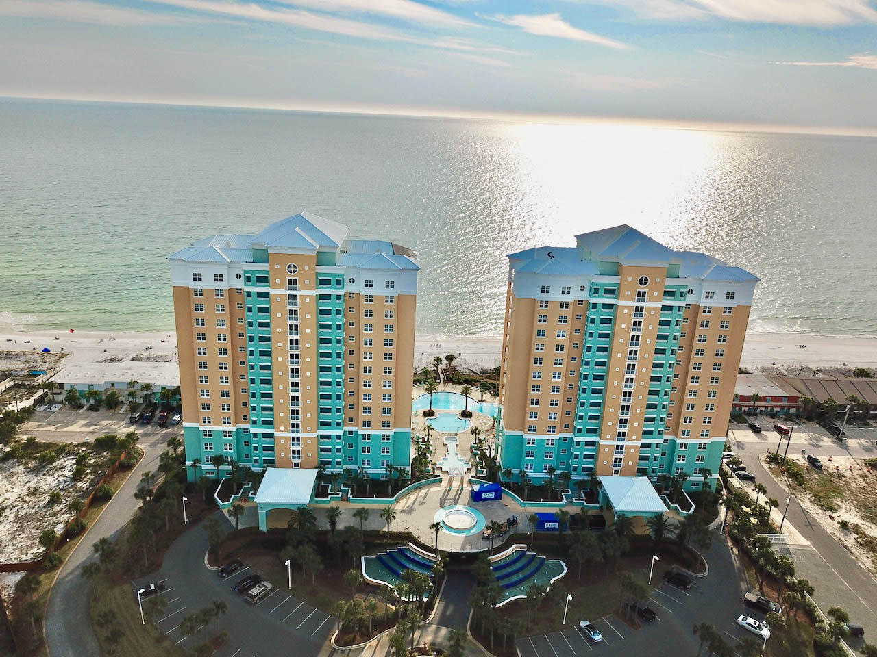 Mediterranean coastal elegance--En Soleil is one of Panama City Beach's finest resorts. Take advantage of this rare opportunity to own an end unit with its spacious balcony and stunning views of the Gulf. Nestled up next to Rick Seltzer Park, enjoy incredible views of the shoreline and the beautiful eastern sunrise's. All walkways and elevators are indoors-no need to worry about getting rained on carrying your groceries! The floor plan has unmatched utility with two bedrooms with bathrooms on suite offering the serene views of the Gulf and the morning sunrise! It's like having two master suites! All three bedrooms are spacious. There is an oversized laundry room with side by side washer and dryer. Both air conditioners and water heater are new. This unit is fully equipped! Tile in all the main and wet areas, including the master bedroom suite, is perfect for low maintenance beach living. The kitchen has beautiful granite countertops and stainless steel appliances. The kitchen is wonderfully open to the living area and has captivating Gulf views. The balcony has terrific space to enjoy with a nice grill all set up for your culinary pleasure! You can be out in the sunshine on the balcony gazing into the beautiful emerald waters or you may pull away from the afternoon summer sun to a cooler, more shaded portion of the balcony. Amenities abound with 24 hr guard and gate security; a Gulf front fitness center; 450 ft of Gulf front, hot tubs and waterfalls; 6500 sq ft of Gulf front pools surrounded by gorgeous patio areas. There are only three units per floor, per building, so no high density. En Soleil is truly a unique Gulf Coast resort experience in Panama City Beach! The location is in the lower traffic portion of Panama City Beach, while just a few miles from the area's best shopping and just down the street from some of the area's best parks and boating.
