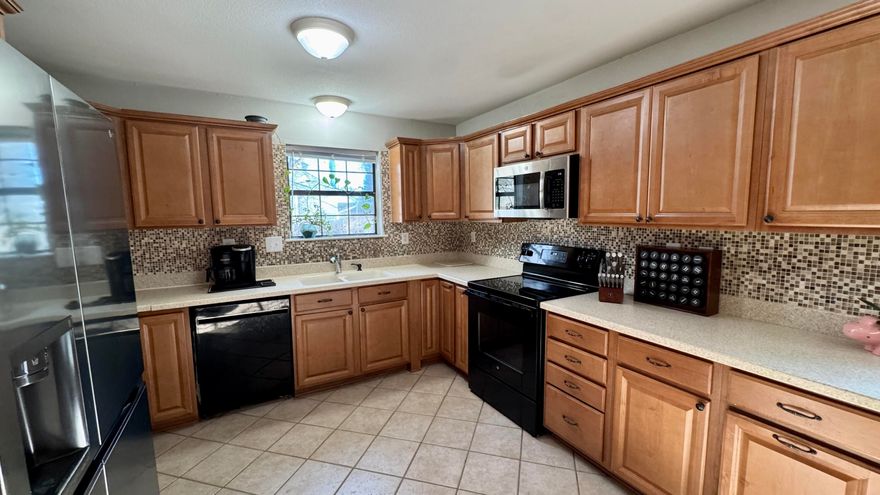 Major updates provide peace of mind, including a roof replaced in 2023. Even better, brand-new flooring will be installed after the sellers move out on April 4th, giving the next owner a fresh, move-in-ready start.Welcome home to a space designed for comfort and connection. Step inside to a spacious living room with soaring ceilings that create an open, airy feel perfect for entertaining or relaxing at the end of the day.Just off the living area, the spacious kitchen and dining area offer the perfect place to gather. Natural light pours in through the French doors, brightening the space and creating an inviting atmosphere while offering views of the huge backyard.Each bedroom features large windows that allow for plenty of natural light, making every room feel warm and welcoming. You'll also appreciate the convenient under-stair storage closet perfect for keeping seasonal decor, pantry overflow, or everyday essentials neatly tucked away. Step outside to a generously sized backyard with endless possibilities whether you envision weekend BBQs, a play area, or a gardening space. This home offers all and it's waiting for it's next chapter.
