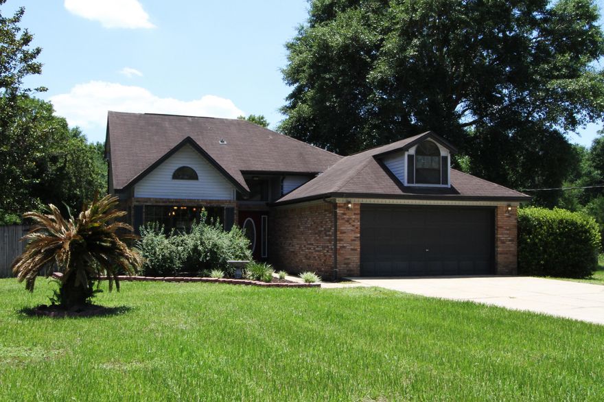 This adorable move-in ready house sits on over a 1/2 acre corner lot. You are greeted with an inviting entryway with lots of charm. Upon entering, you will see an open floor plan featuring a beautiful kitchen with stainless steel appliances, a breakfast bar, and an island, perfect for preparing dinner. The living room and kitchen have vaulted ceilings for a more open feeling. The nice-sized master suite has a large closet and an amazing master bath that will not disappoint. It has a beautiful claw-foot tub, a separate walk-in shower, dual vanities, and tons of storage! The large fenced backyard has plenty of room for entertaining. The covered screened-in patio has a nice bonus.....a HOT TUB to relax in! There is even a covered carport in the back for your extra vehicles or tools.