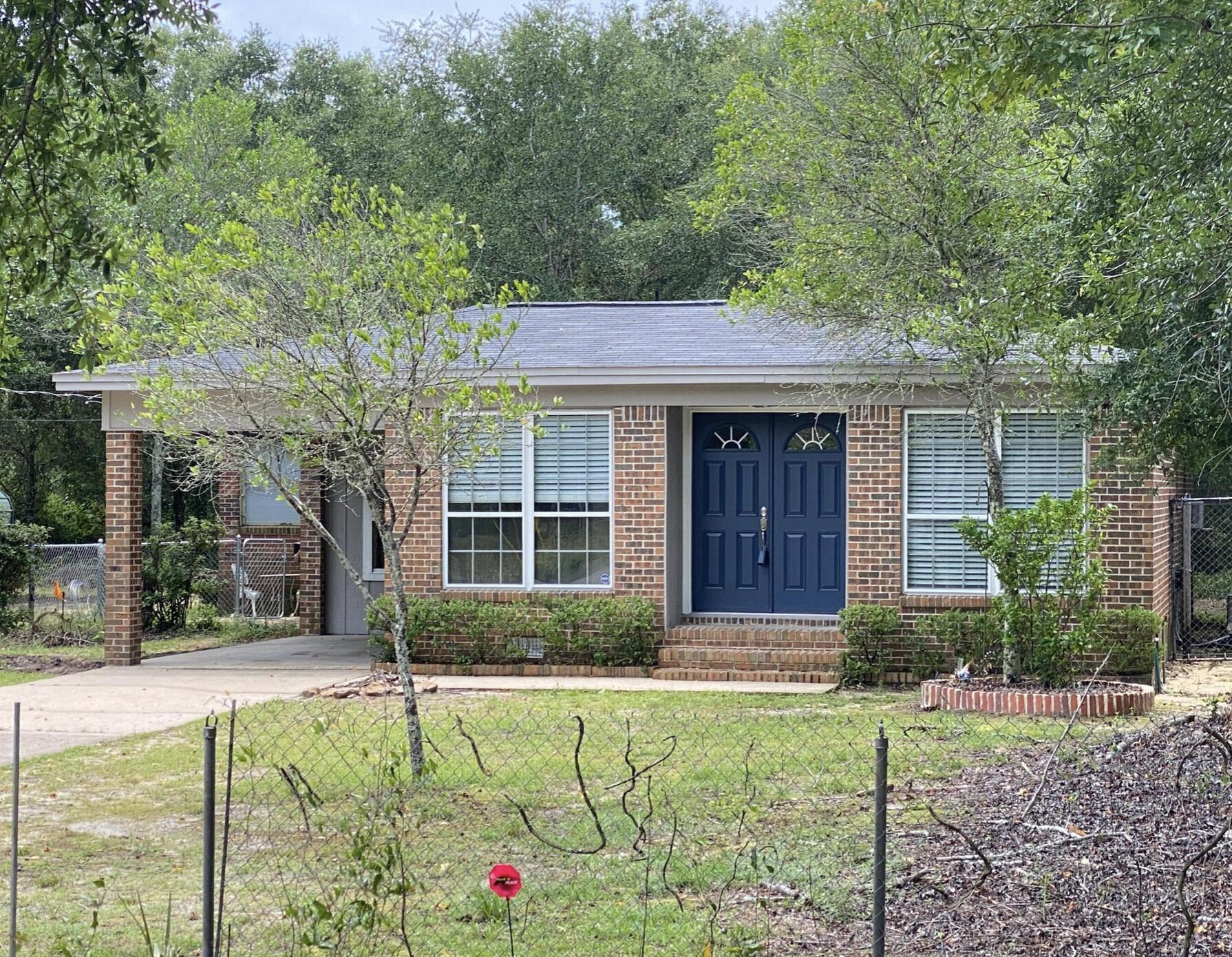 Buyer's loan fell thru, back on the market & Seller said ''SELL IT''. Less than a mile to Eglin east gate. A Block from Toms Bayou. This 3/2 has had many updates. New flooring though out, Updated bathroom, new entryway. It is a brick charmer. A nice wooded DOUBLE lot, covered carport. This home is loaded with charm. A must see. Does need some TLC